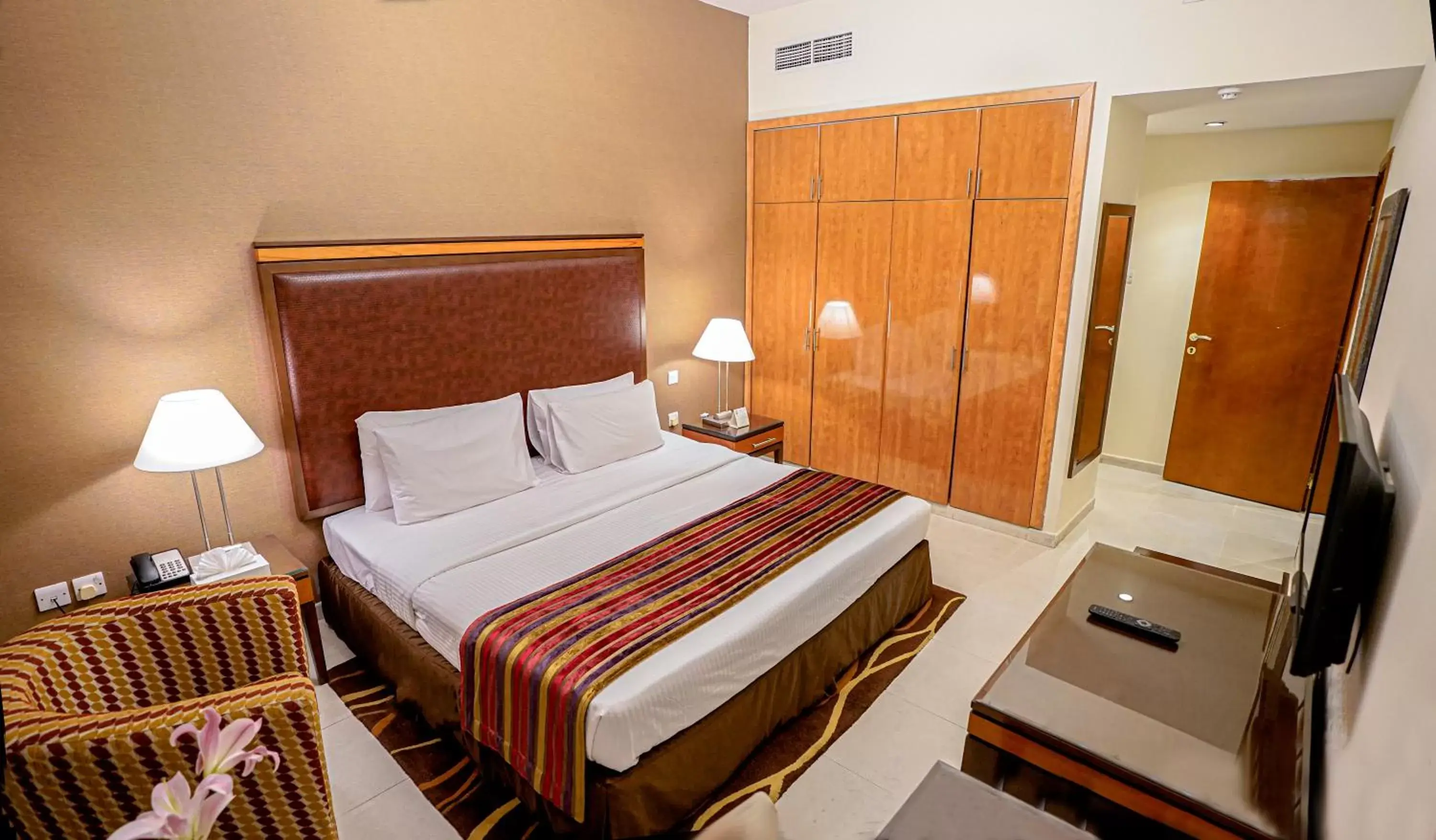 Bed in Xclusive Hotel Apartments