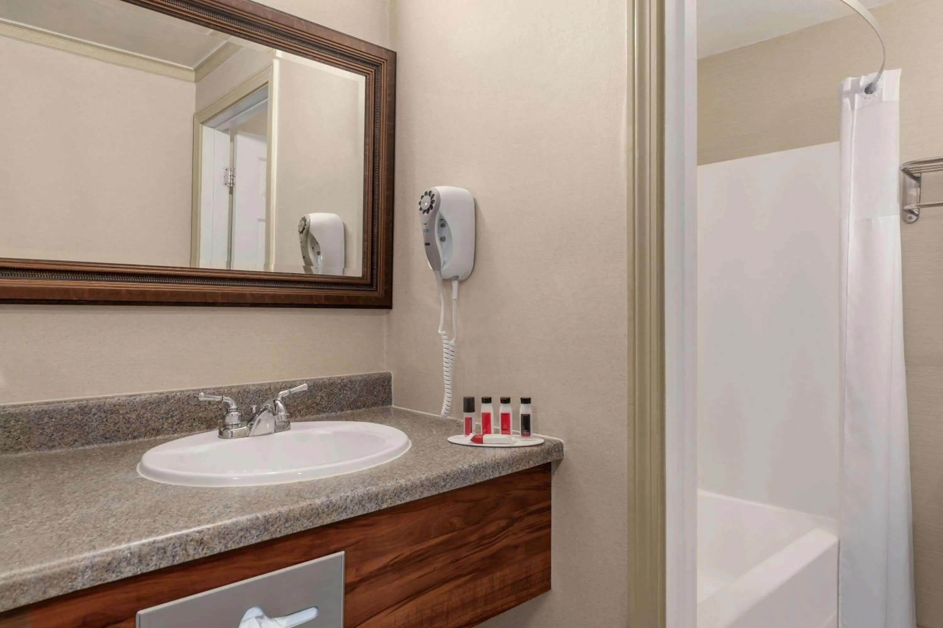 Bathroom in Days Inn by Wyndham Airport/Maine Mall