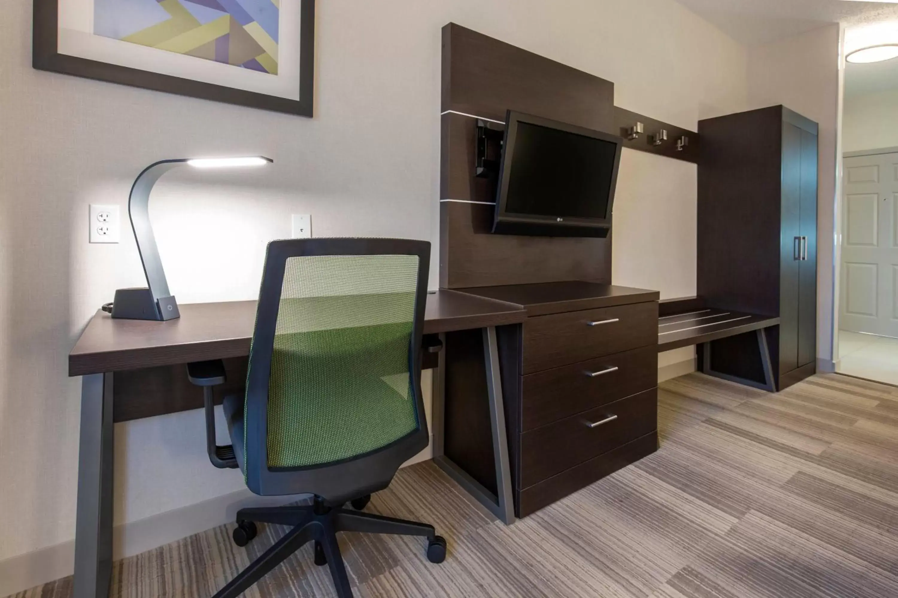 Photo of the whole room, TV/Entertainment Center in Holiday Inn Express and Suites Chicago West - St Charles, an IHG Hotel