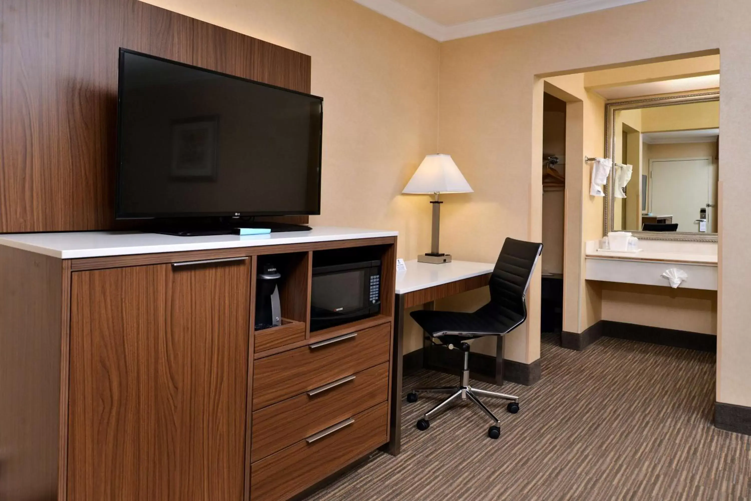 Photo of the whole room, TV/Entertainment Center in Best Western Hollywood Plaza Inn Hotel - Hollywood Walk of Fame LA