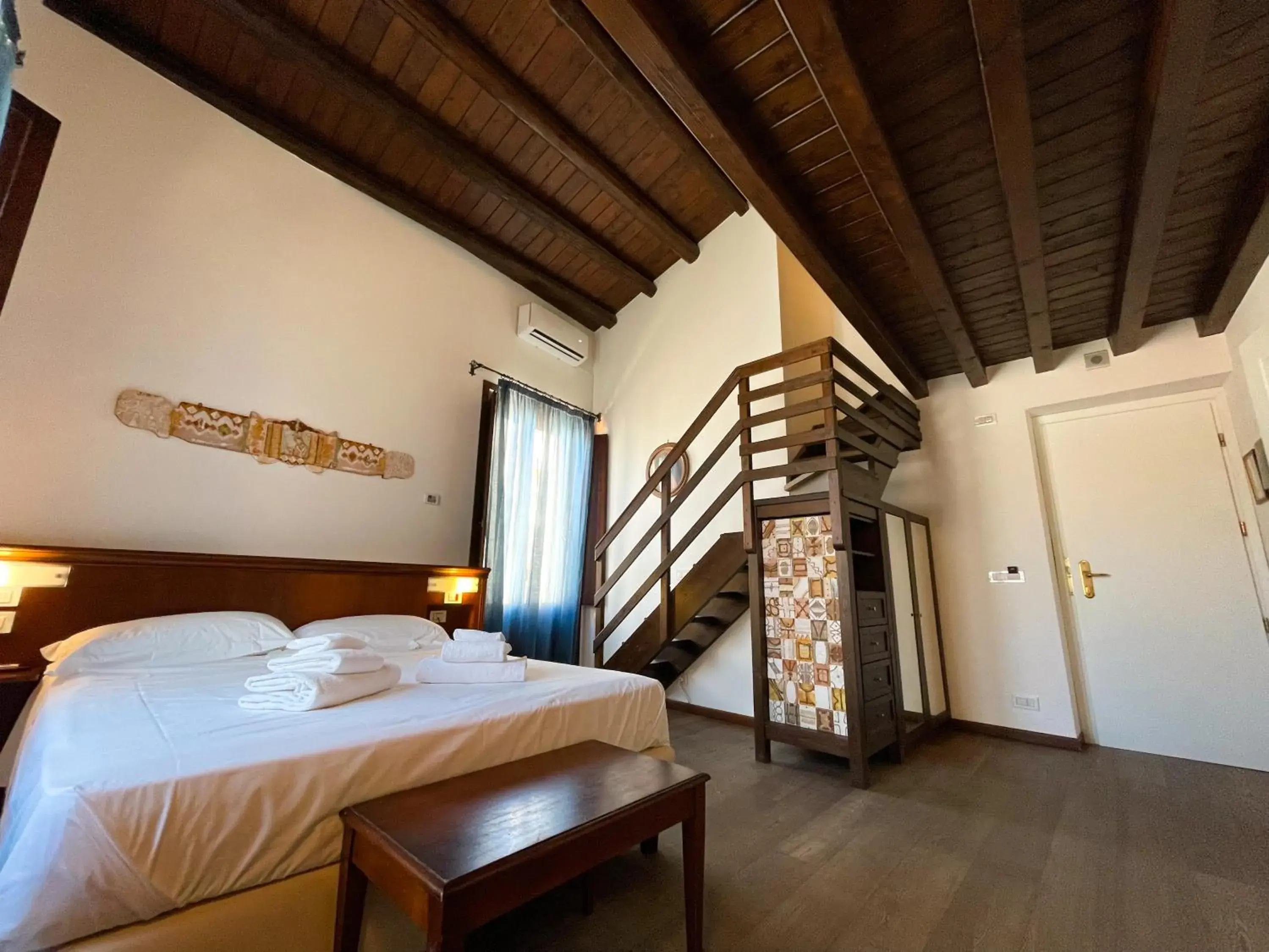 Bed in Hotel La Plumeria