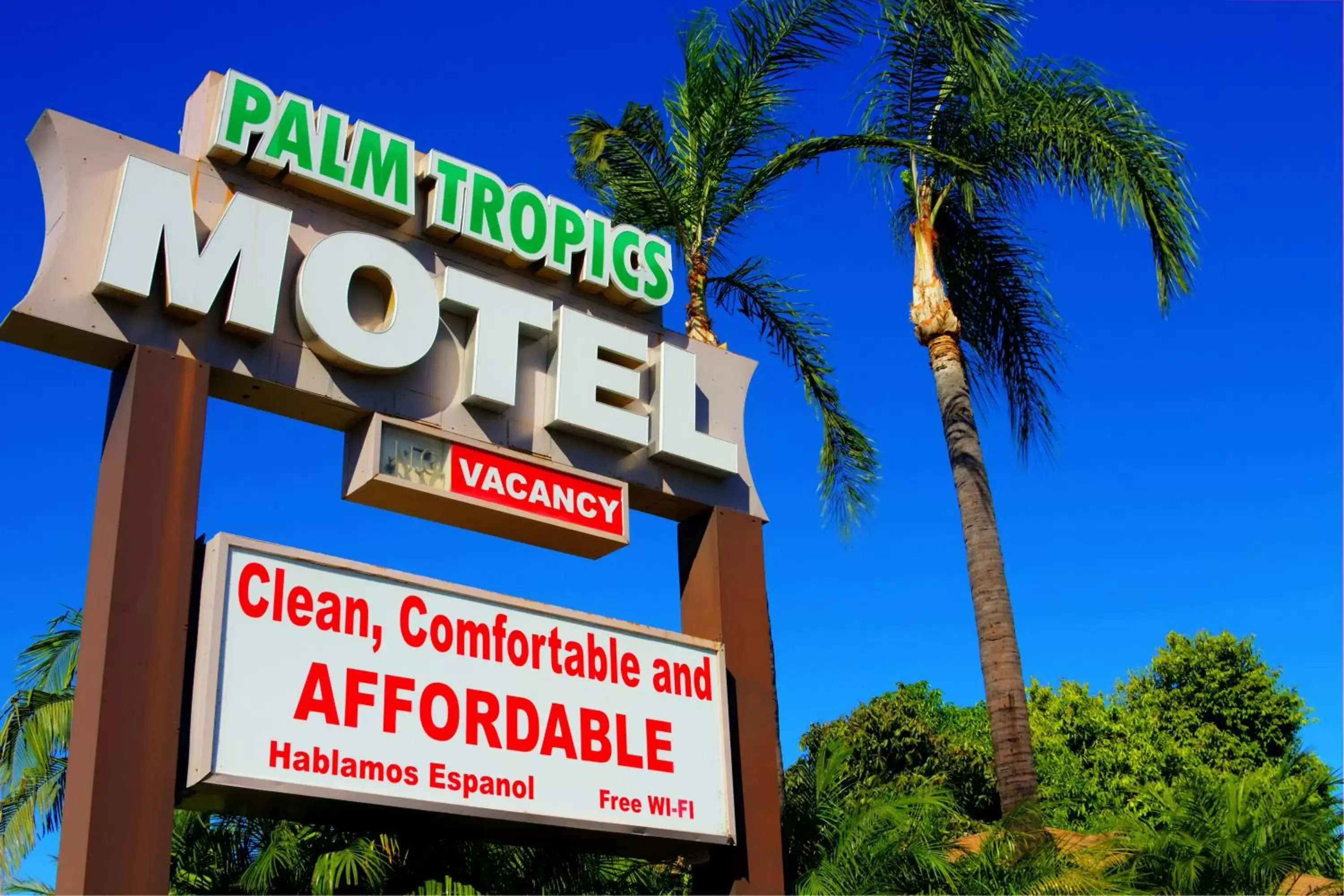 Property logo or sign in Palm Tropics Motel