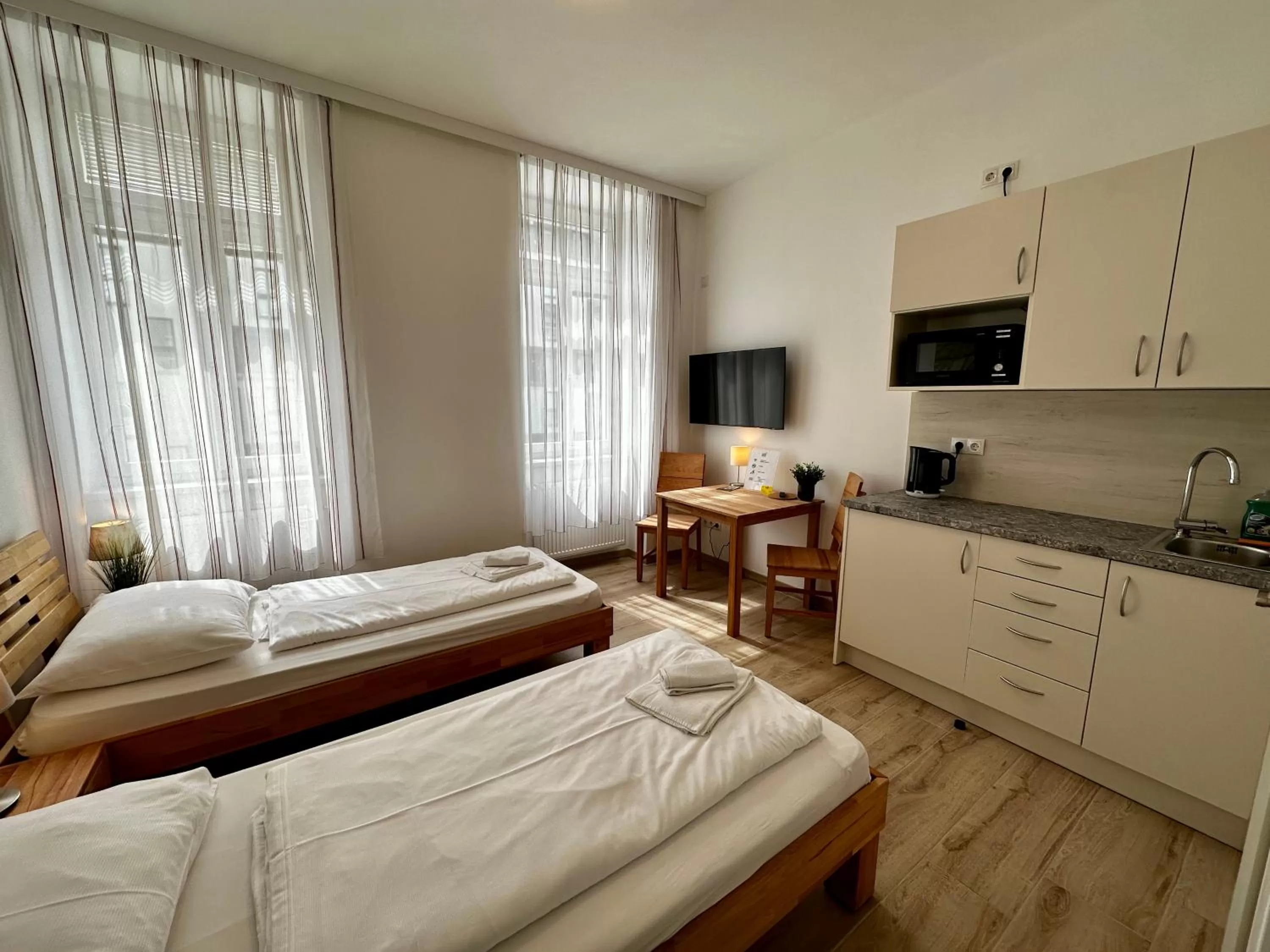 Photo of the whole room, Bed in AJO Apartments - Messe City Flat - Self-Check-in