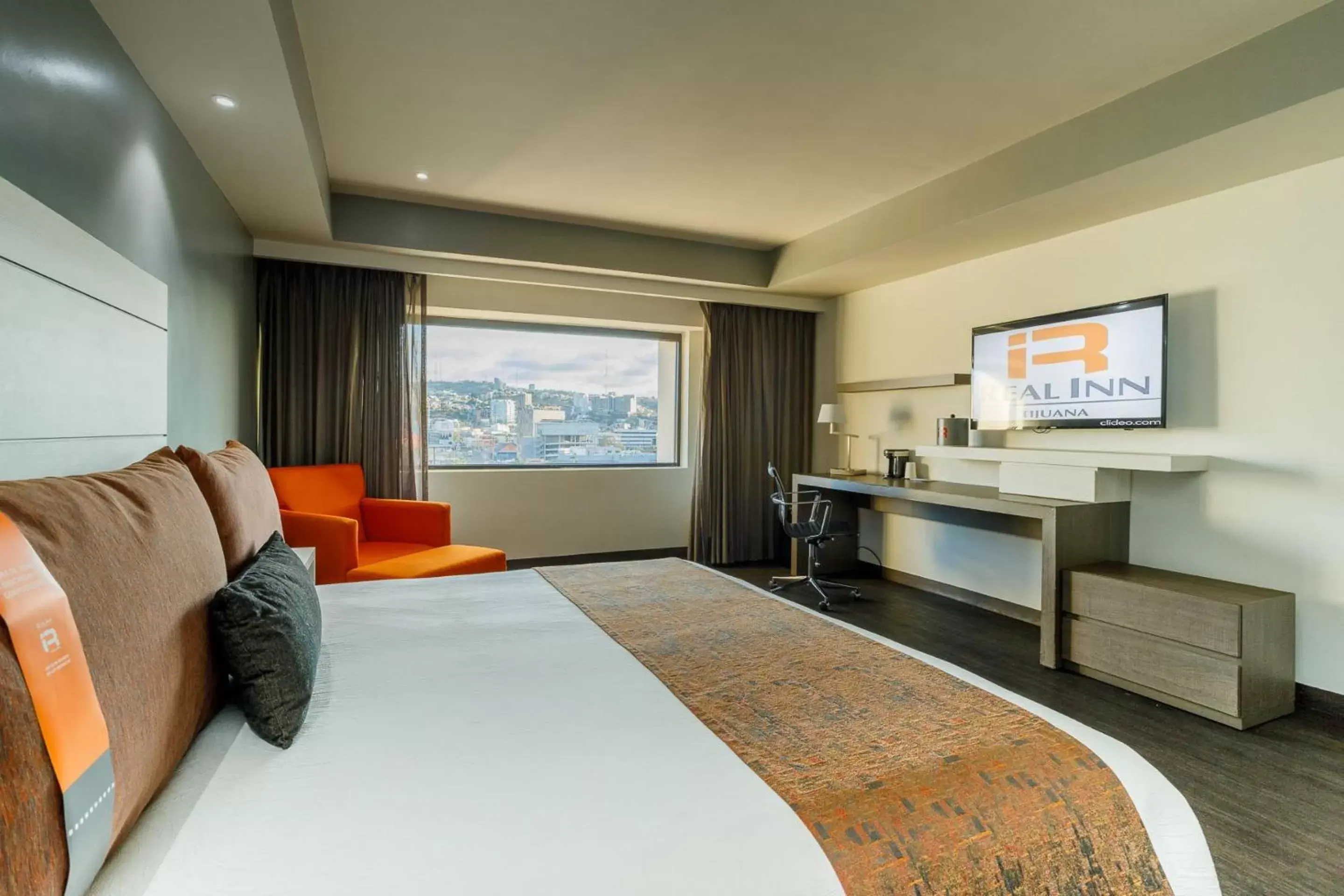 Bedroom, TV/Entertainment Center in Real Inn Tijuana by Camino Real Hotels
