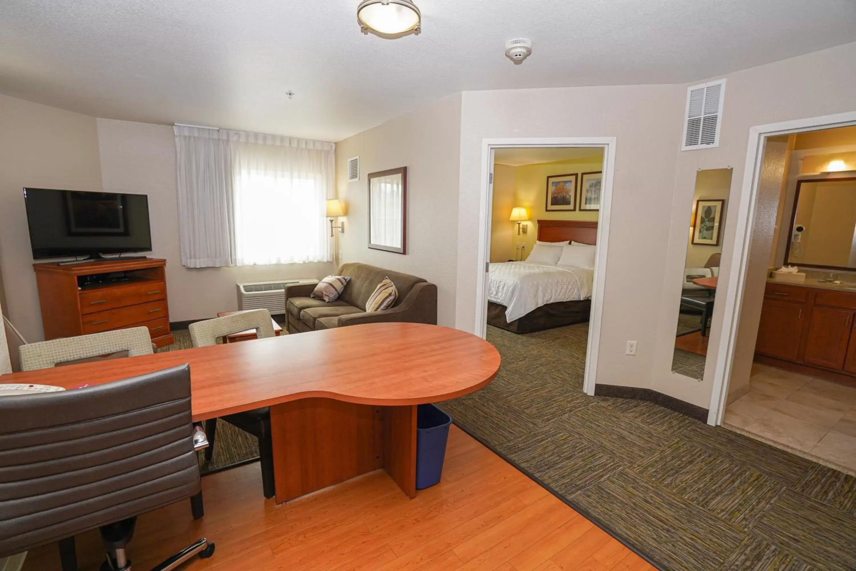 Bedroom, Seating Area in Candlewood Suites Boise - Towne Square, an IHG Hotel