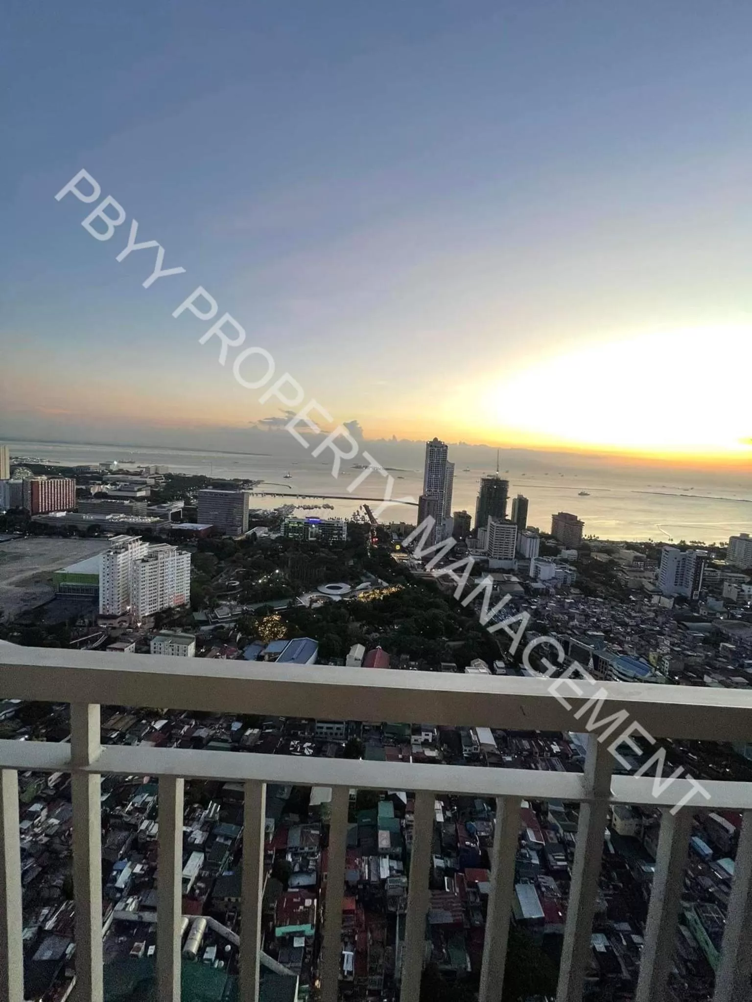 Sunset in Green Residences Staycation by PBYY