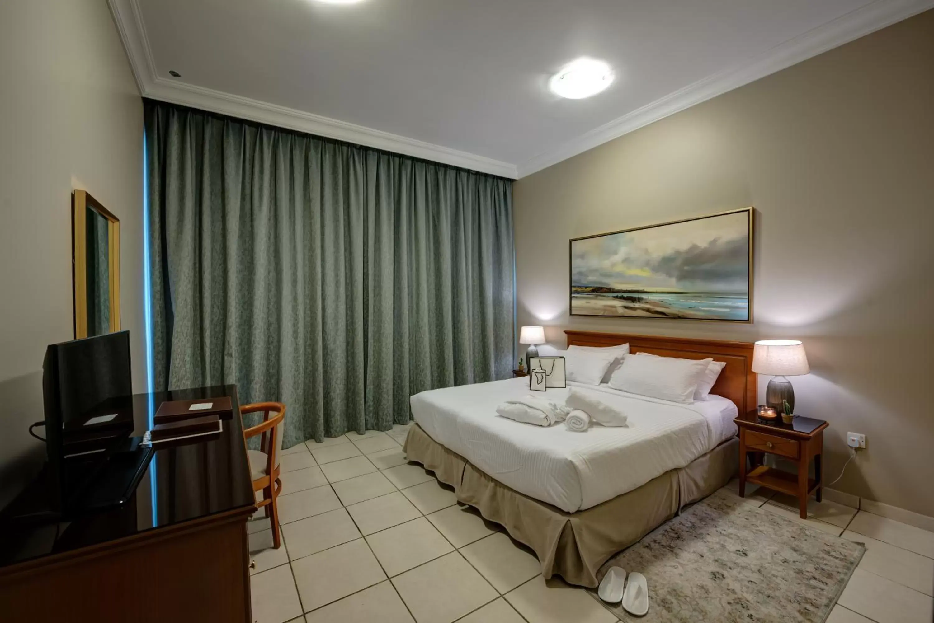 Bed, TV/Entertainment Center in Al Nakheel Hotel Apartments Abu Dhabi