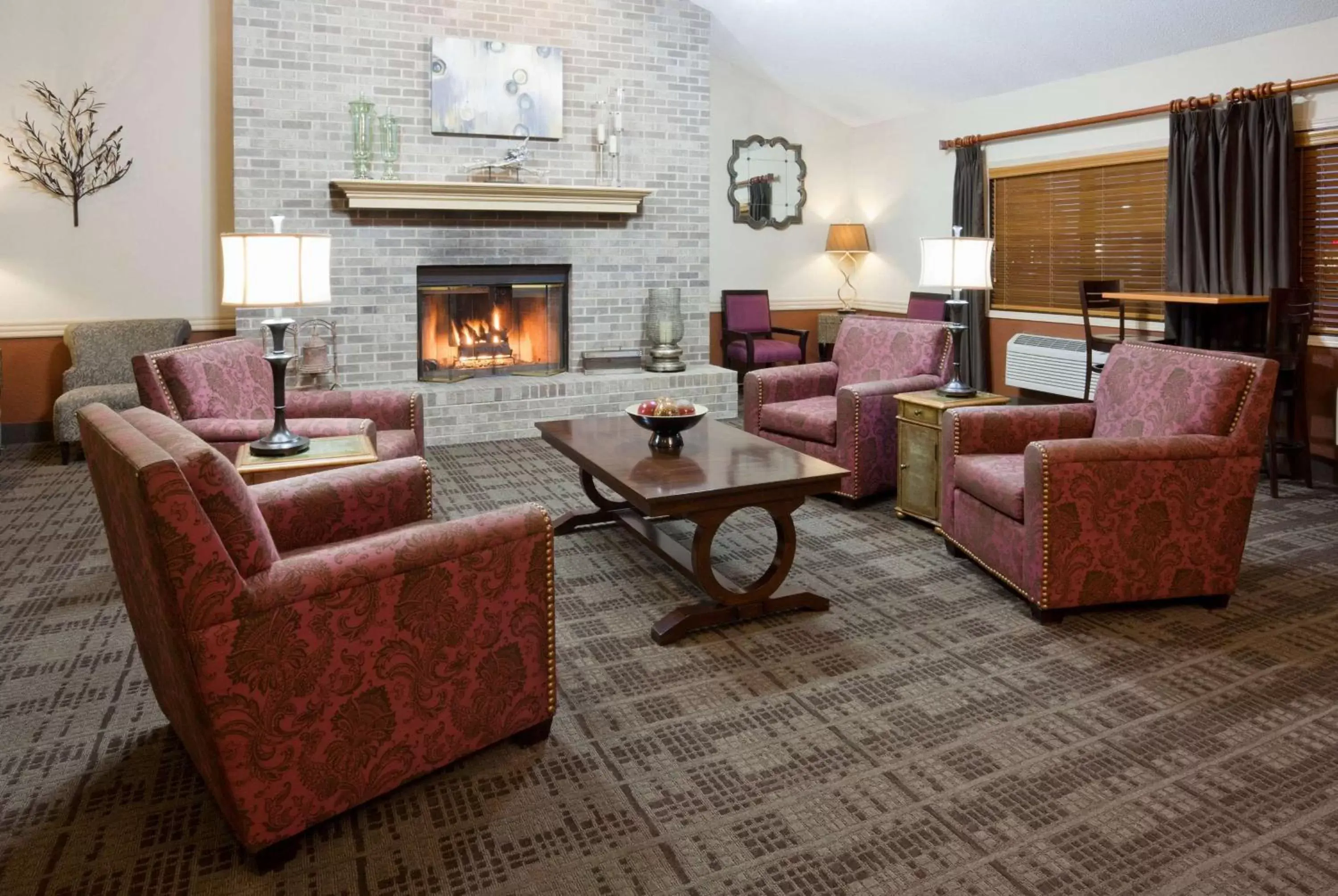 Lobby or reception, Seating Area in AmericInn by Wyndham Osceola