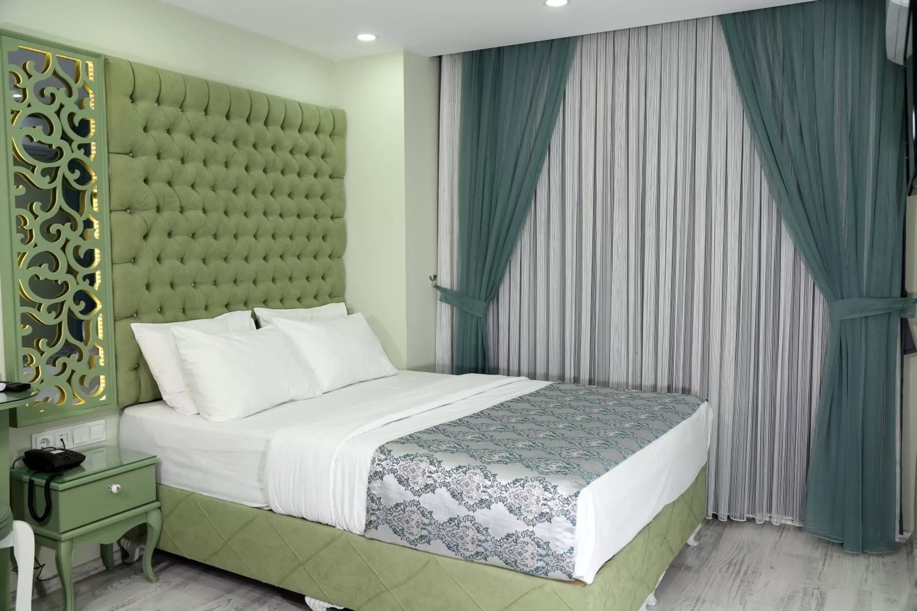 Bed in Green Garden Hotel