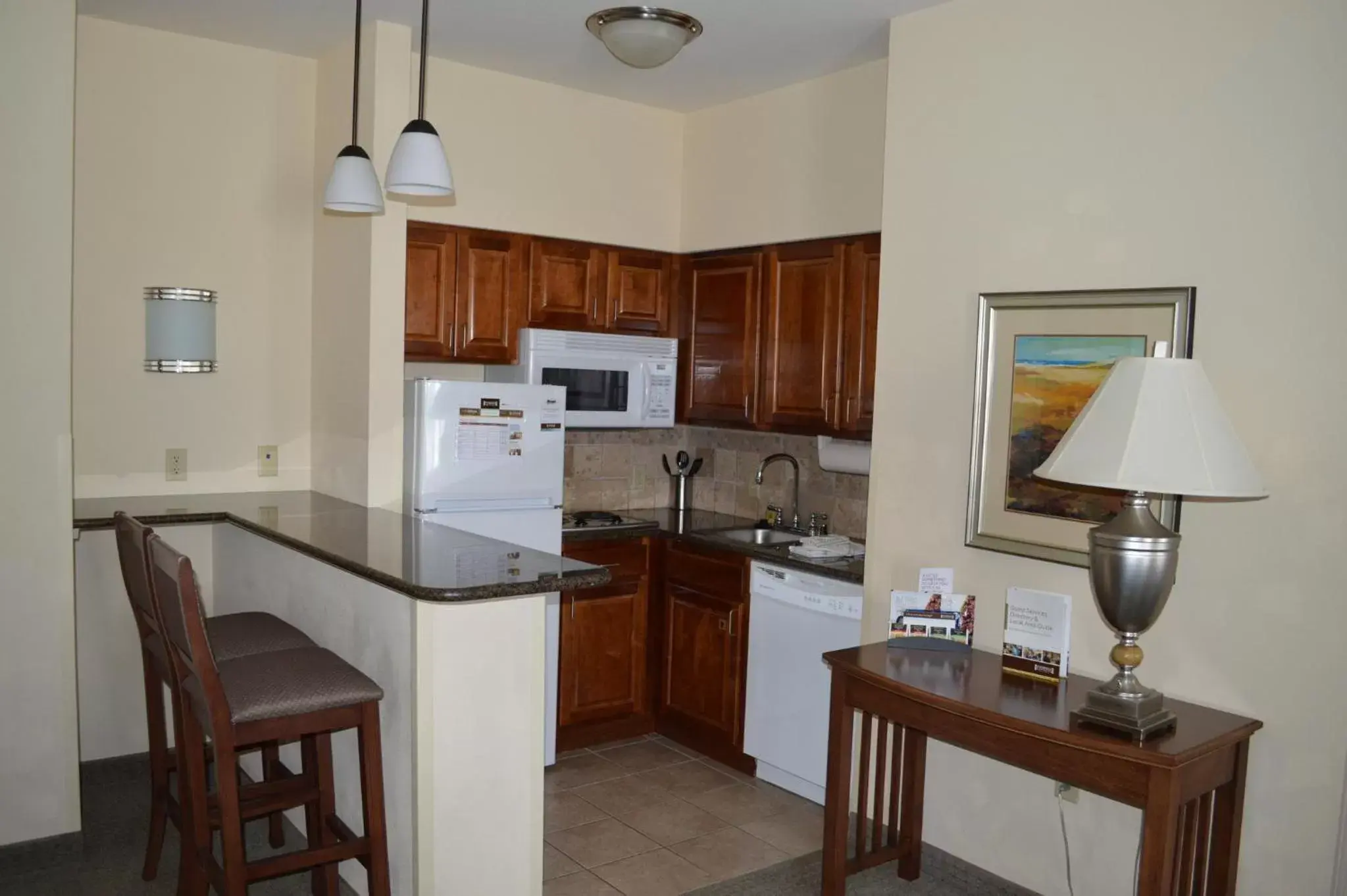 Photo of the whole room, Kitchen/Kitchenette in Staybridge Suites Milwaukee West-Oconomowoc, an IHG Hotel