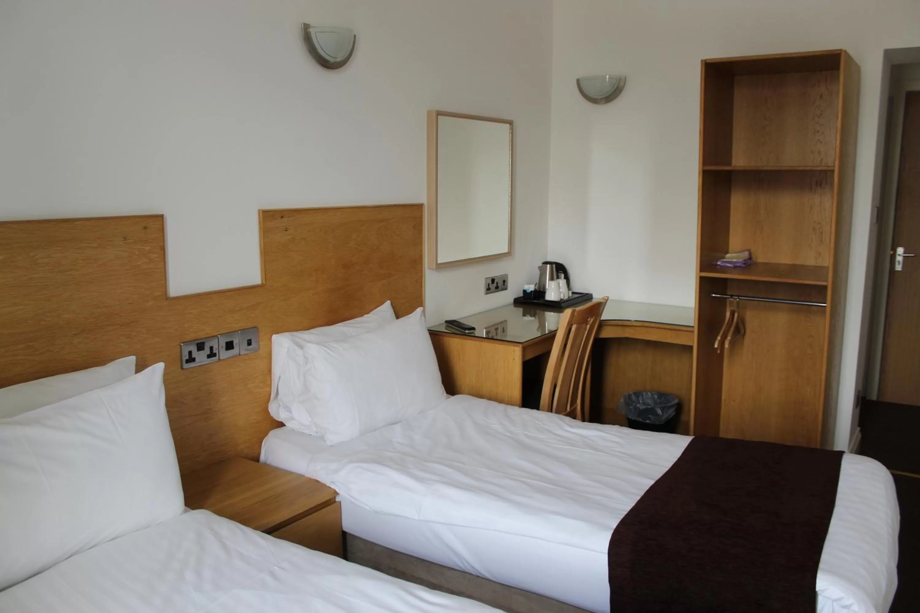 Bed in Four Saints Brig Y Don Hotel