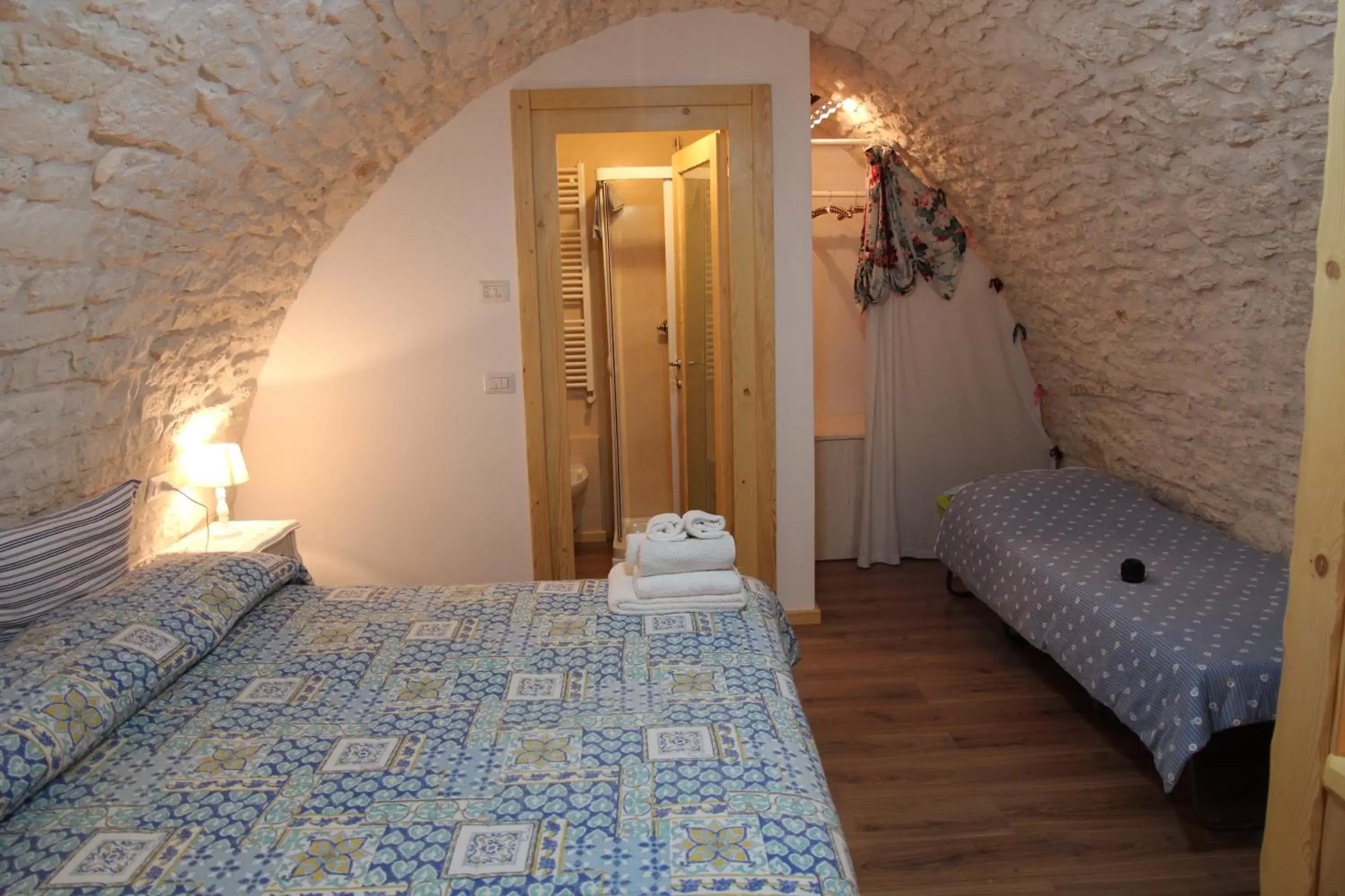 Photo of the whole room, Bed in B&B Trulli Donna Isabella