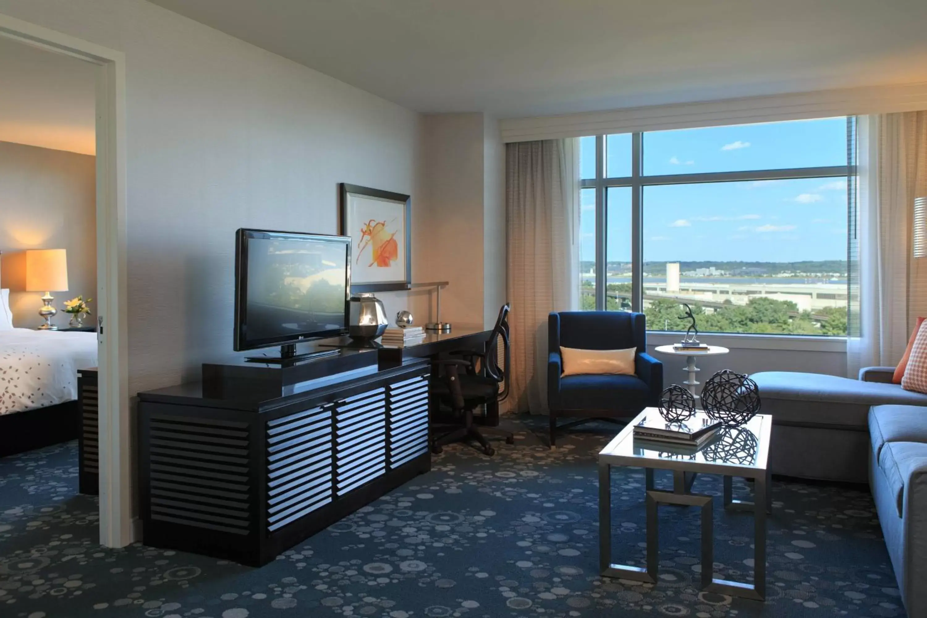 Bedroom, TV/Entertainment Center in Renaissance Arlington Capital View Hotel