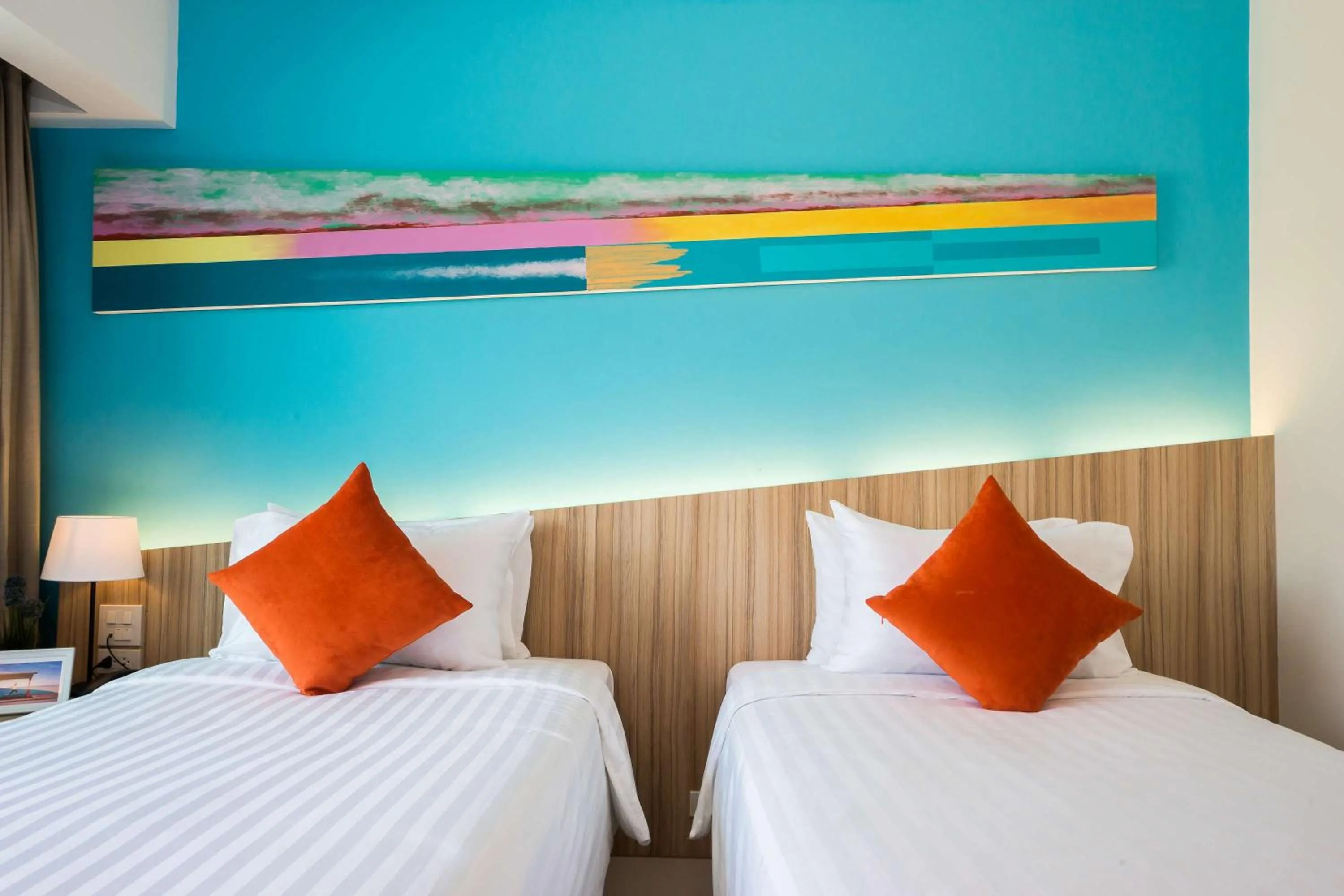 Bed in J Inspired Hotel Pattaya