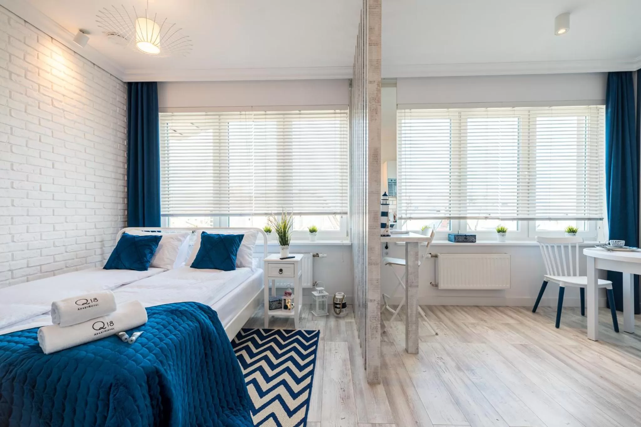 Communal lounge/ TV room, Bed in Q18 ApartHotel