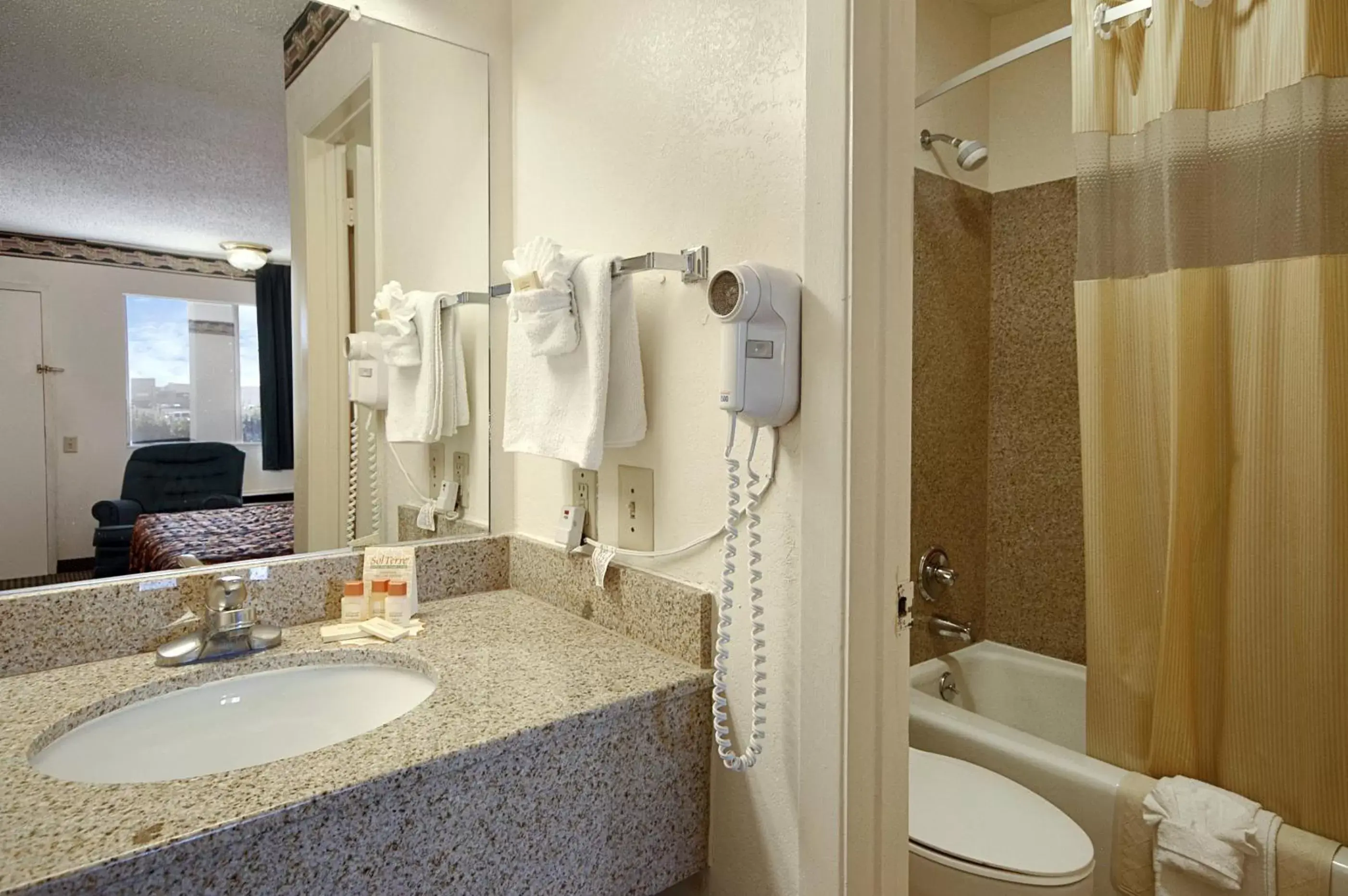 Bathroom in Days Inn by Wyndham Dallas Irving