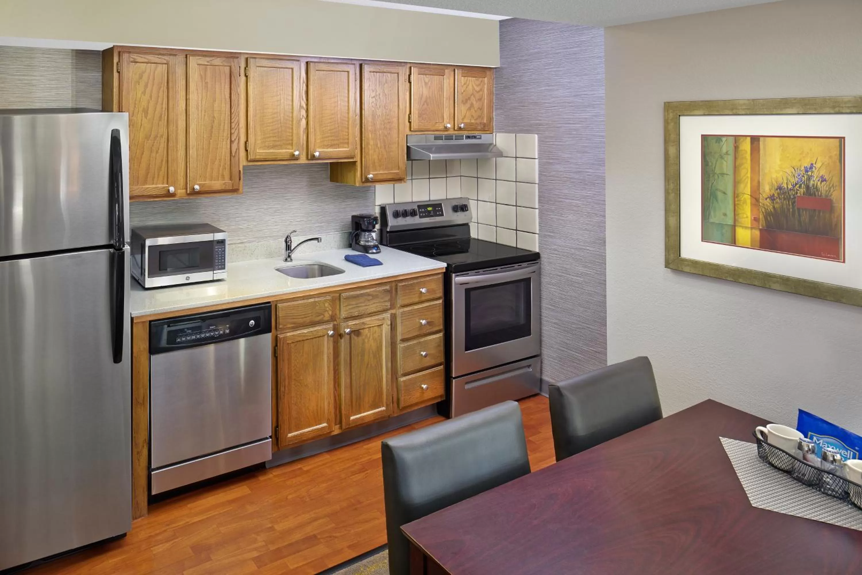 Kitchen or kitchenette in New Haven Village Suites