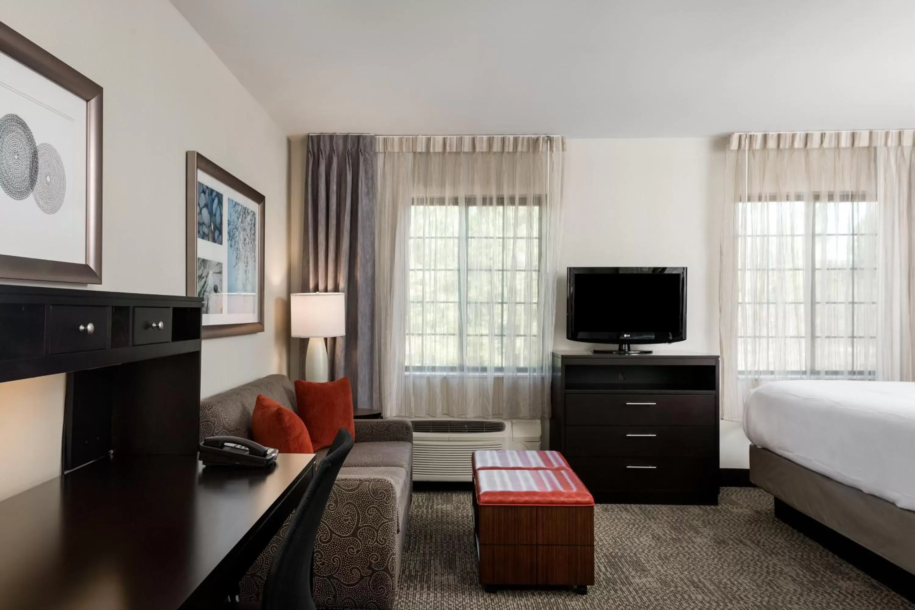 Photo of the whole room, TV/Entertainment Center in Staybridge Suites Chantilly Dulles Airport, an IHG Hotel