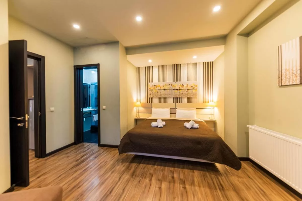 Bed in Sani Apart Hotel