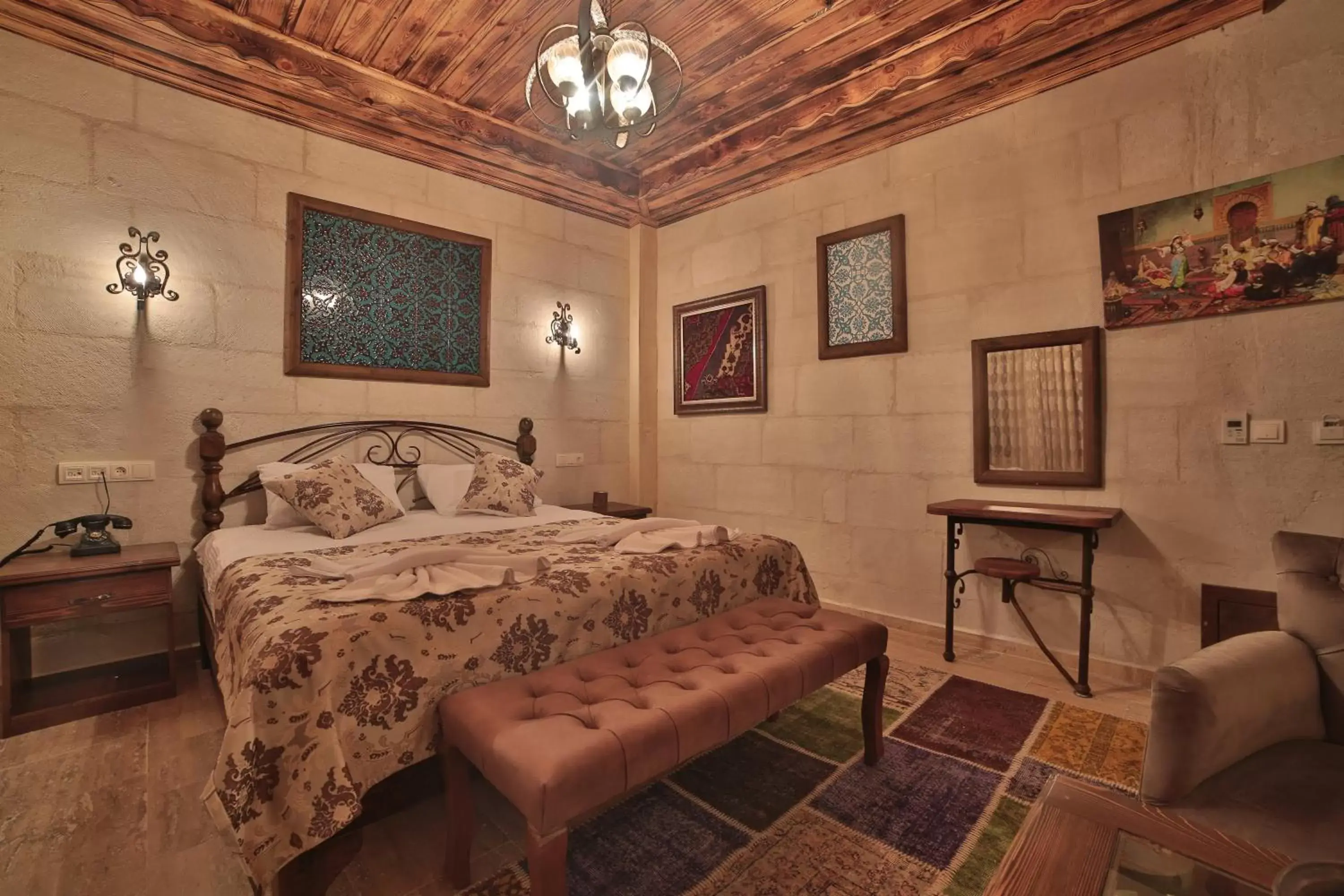 Bed in Caravanserai Inn Hotel