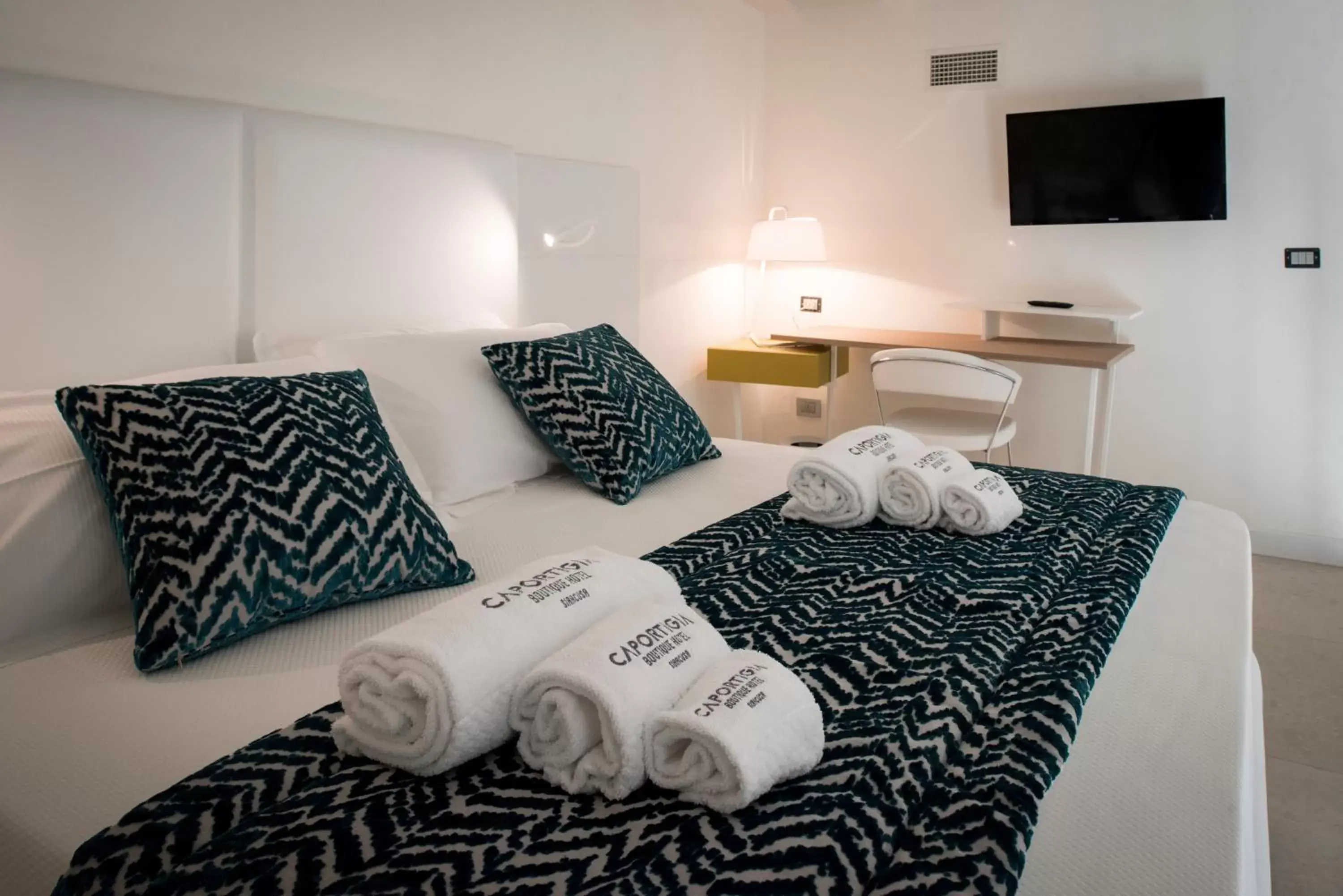 Bed in Caportigia Boutique Hotel