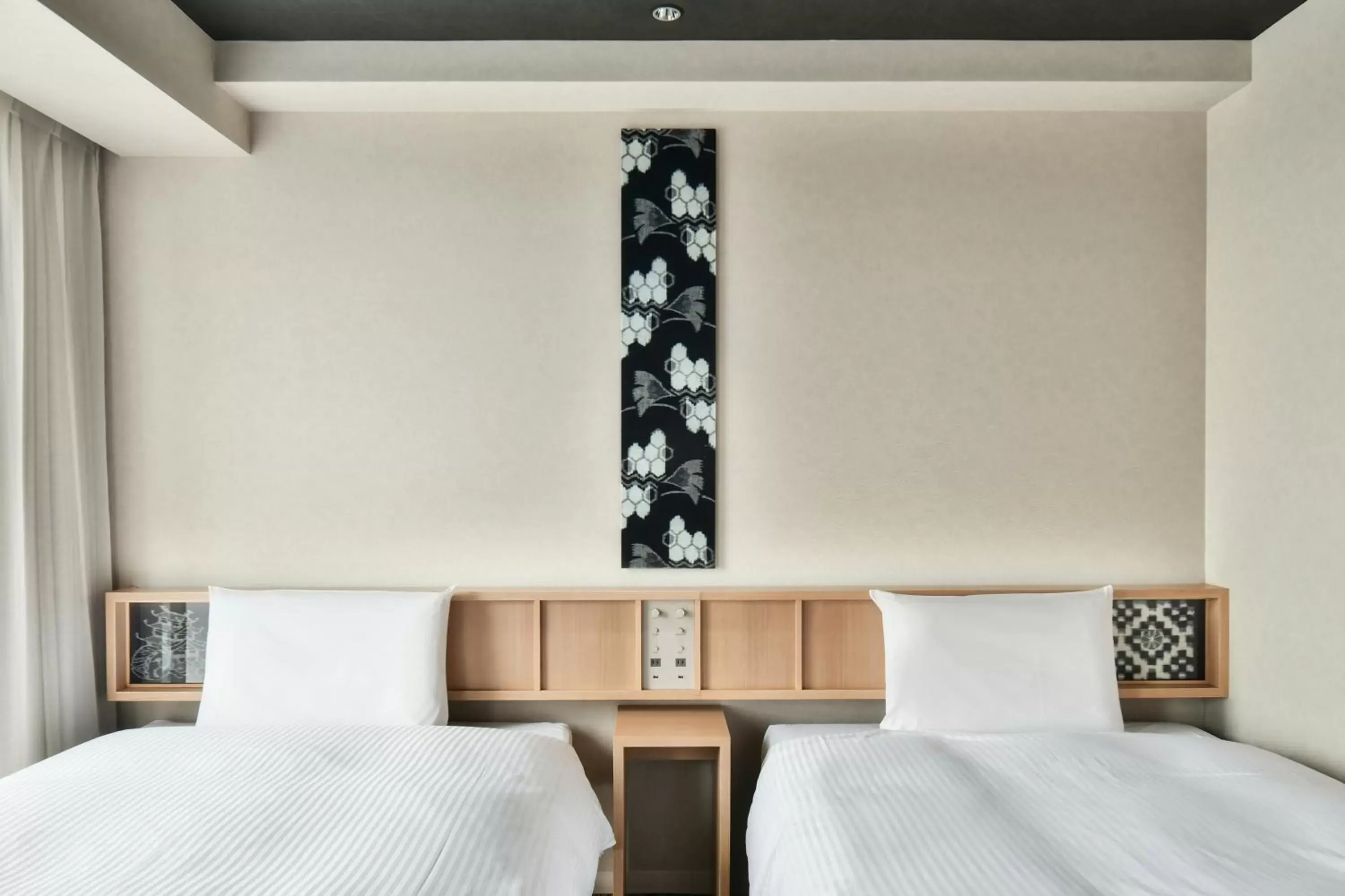 Bed in REF Matsuyama City Station by VESSEL HOTELS