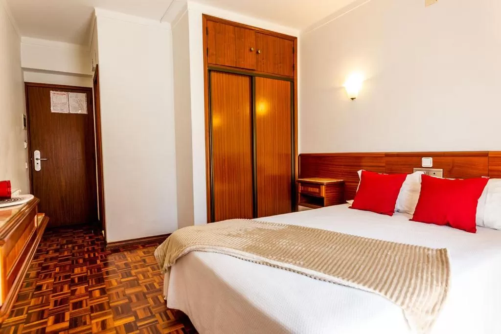 Bed in Dona Amélia Hotel by RIDAN Hotels