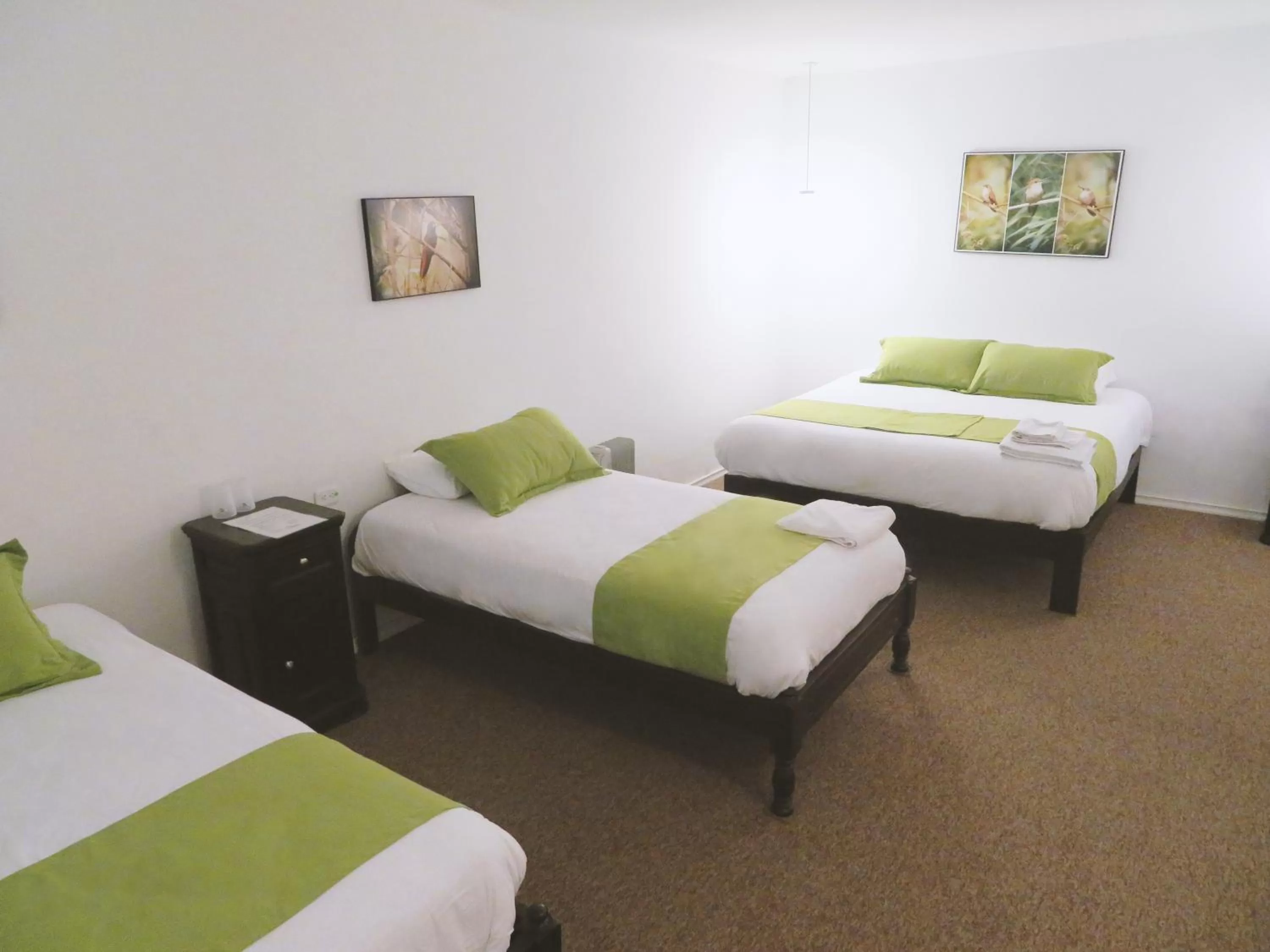 Bed in Bird Garden Guest House