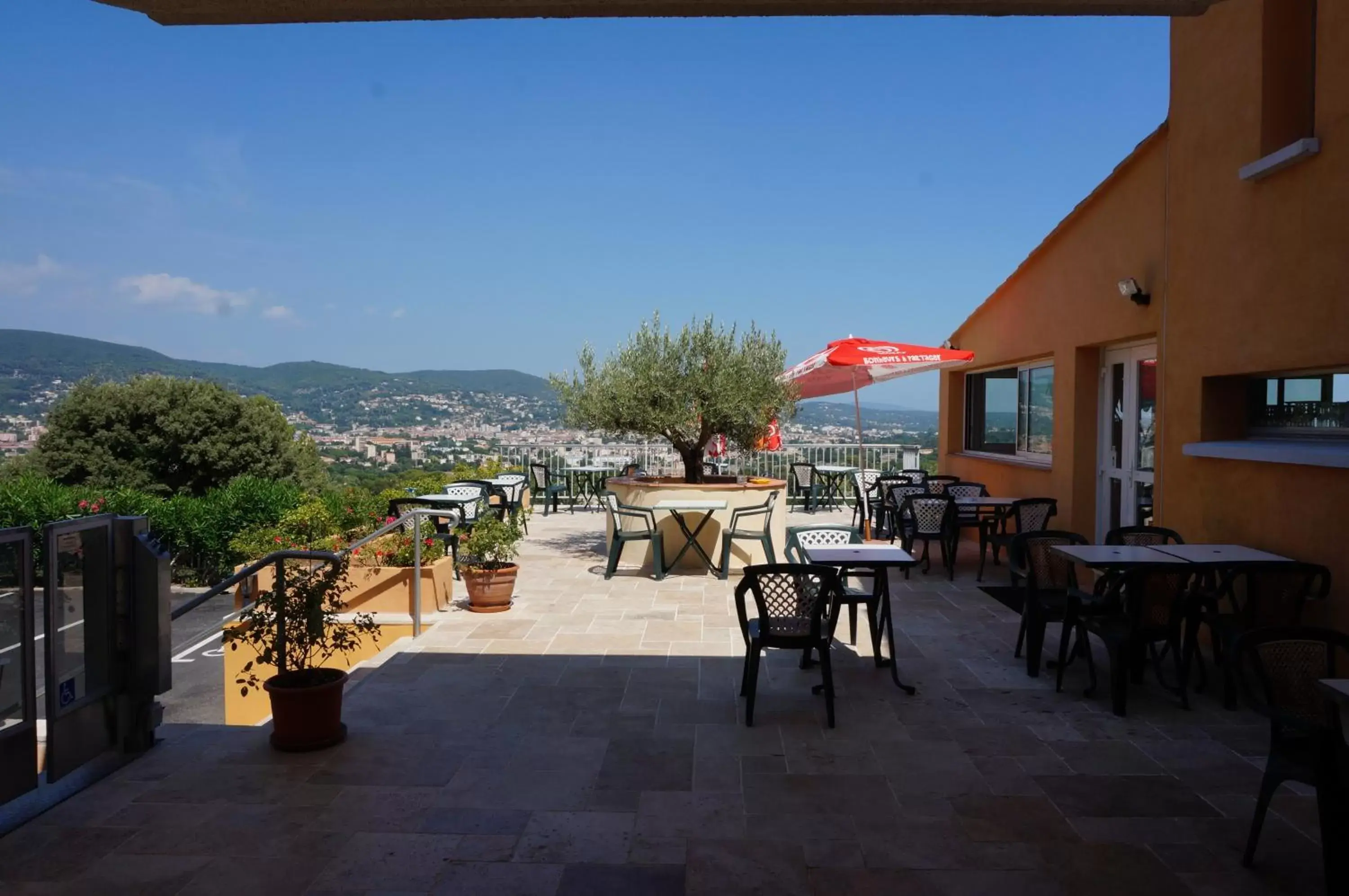 Patio in Logis Hotel Le Col De L'ange