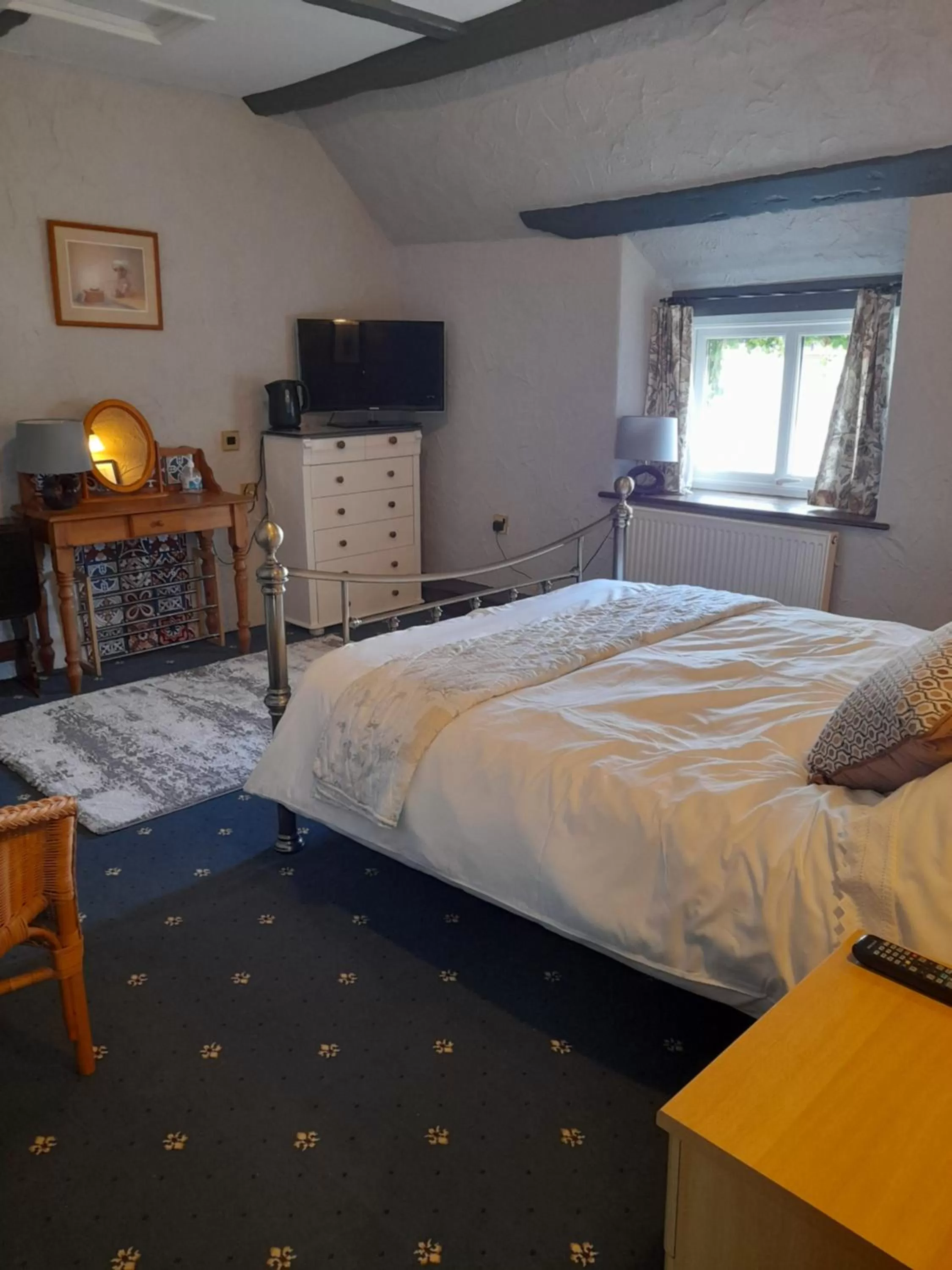 Bed in The Golden Lion Inn