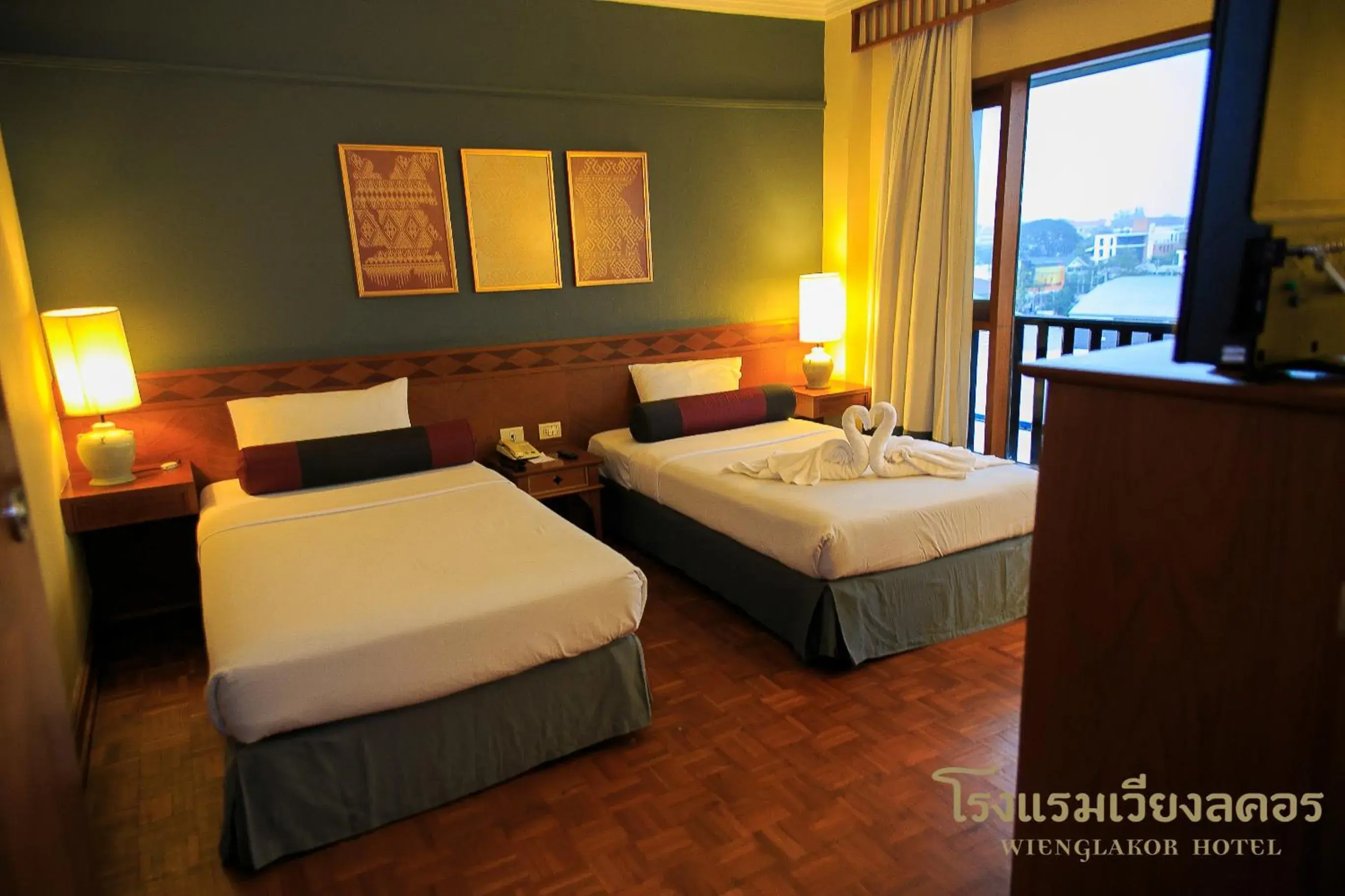 Photo of the whole room, Bed in Wienglakor Hotel (SHA Extra Plus)