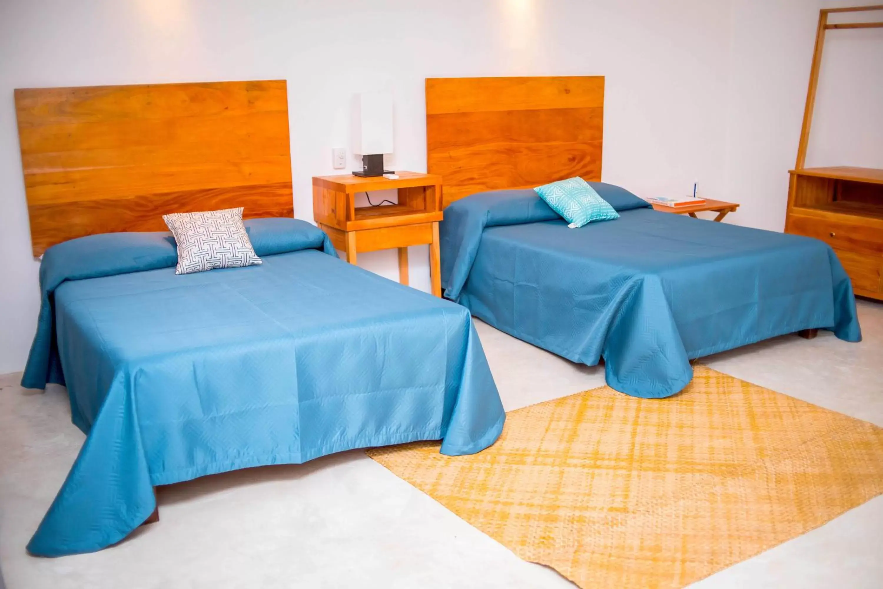 Bed in Royal Palm Bacalar Cabañas & Lagoon Club