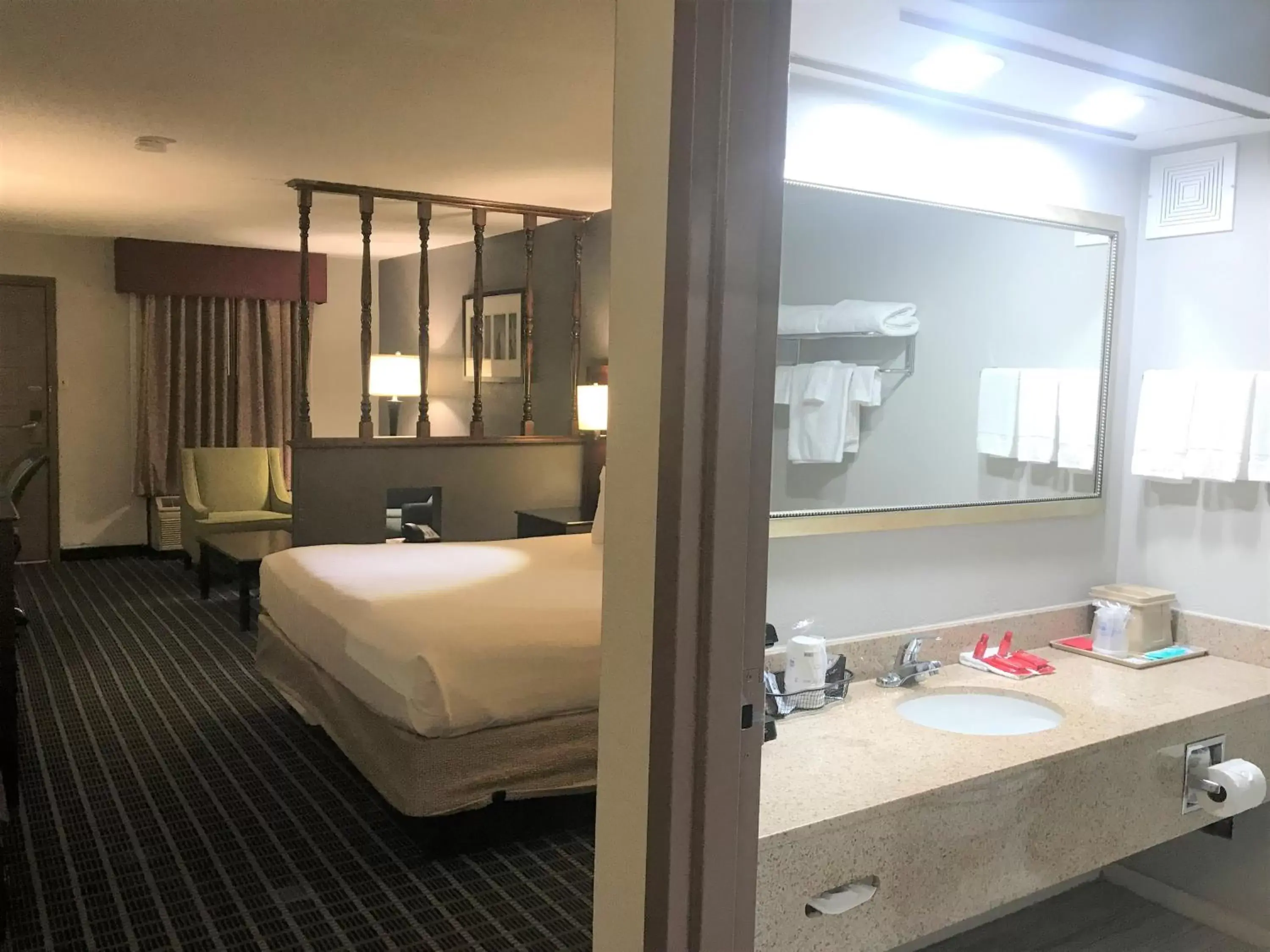 Bed, Bathroom in SureStay Plus Hotel by Best Western Greenwood