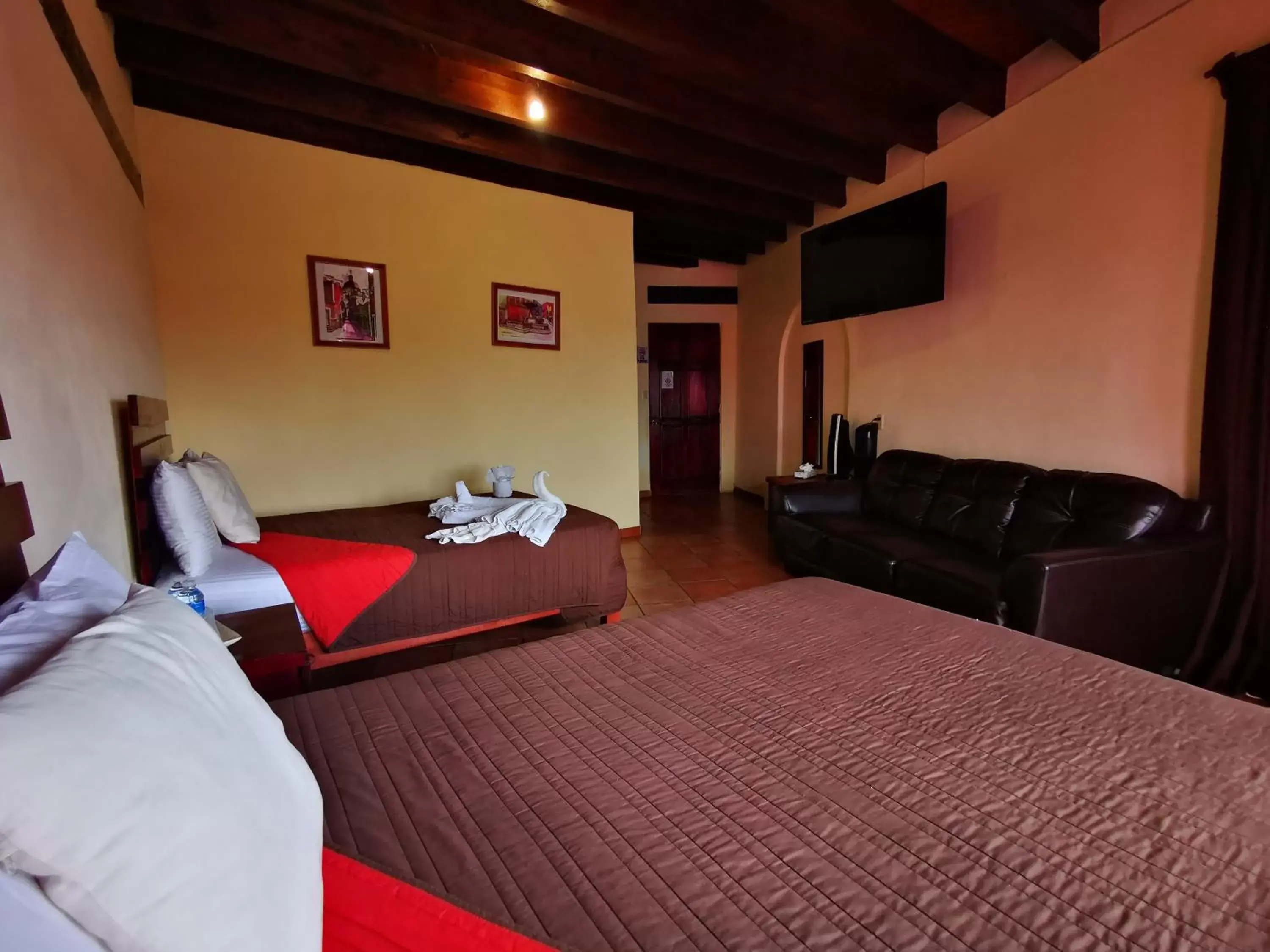 Bed, Seating Area in Hotel Chocolate Suites