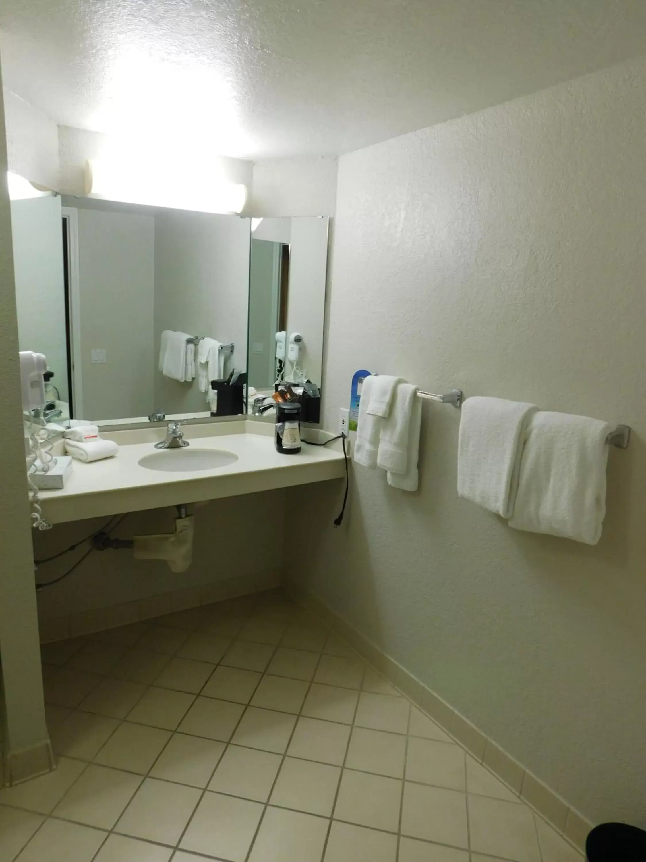 Bathroom in Days Inn & Suites by Wyndham Schaumburg- Woodfield Mall