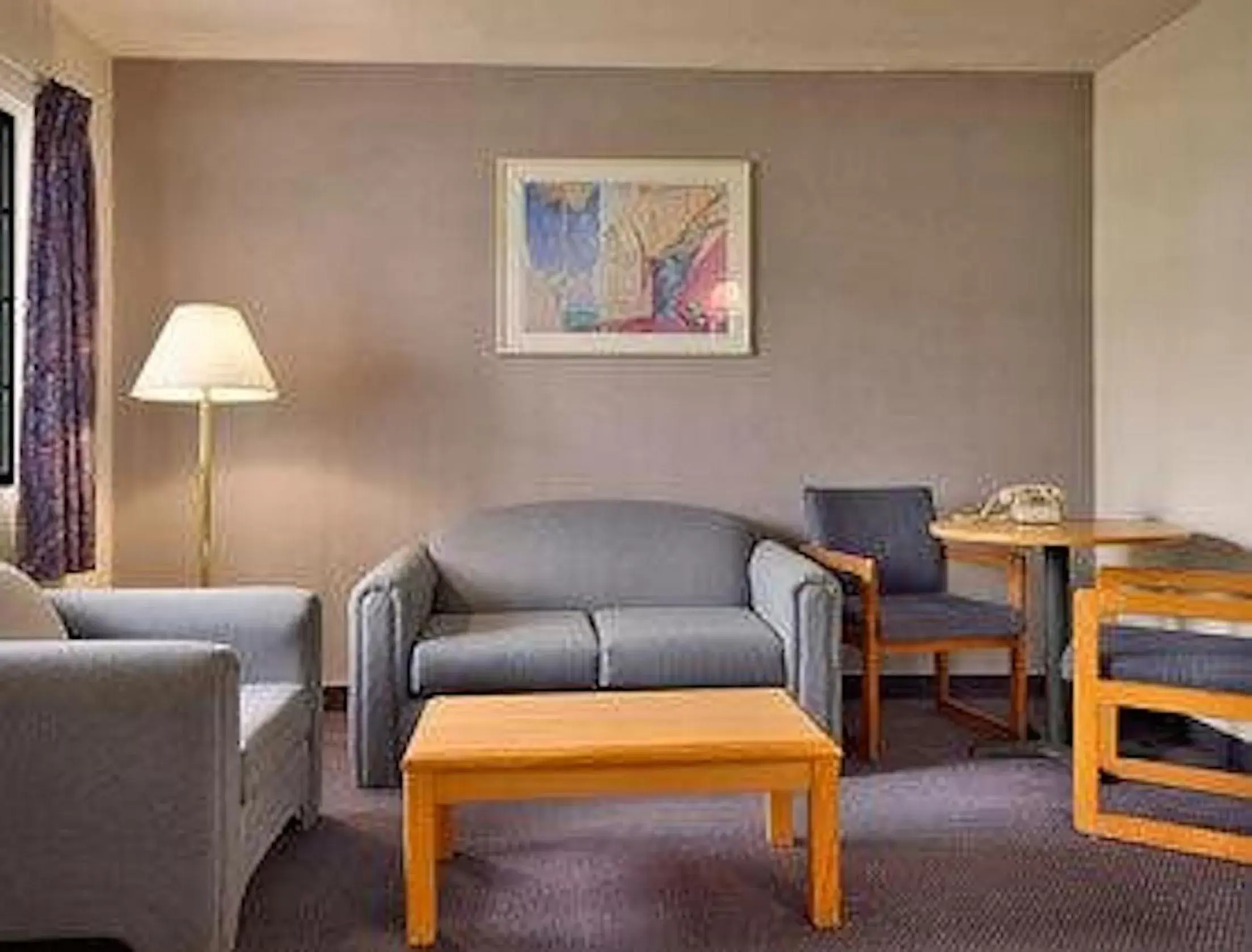 Bedroom, Seating Area in Days Inn & Suites by Wyndham Needles