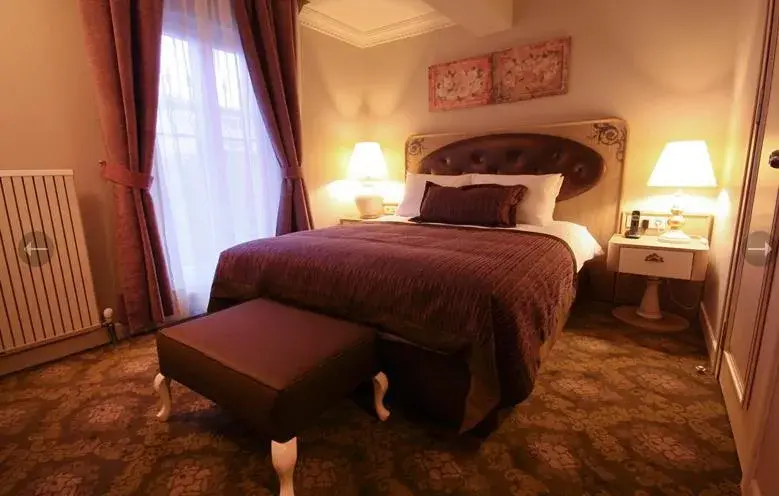 Bed in Sonno Boutique Rooms & Suites