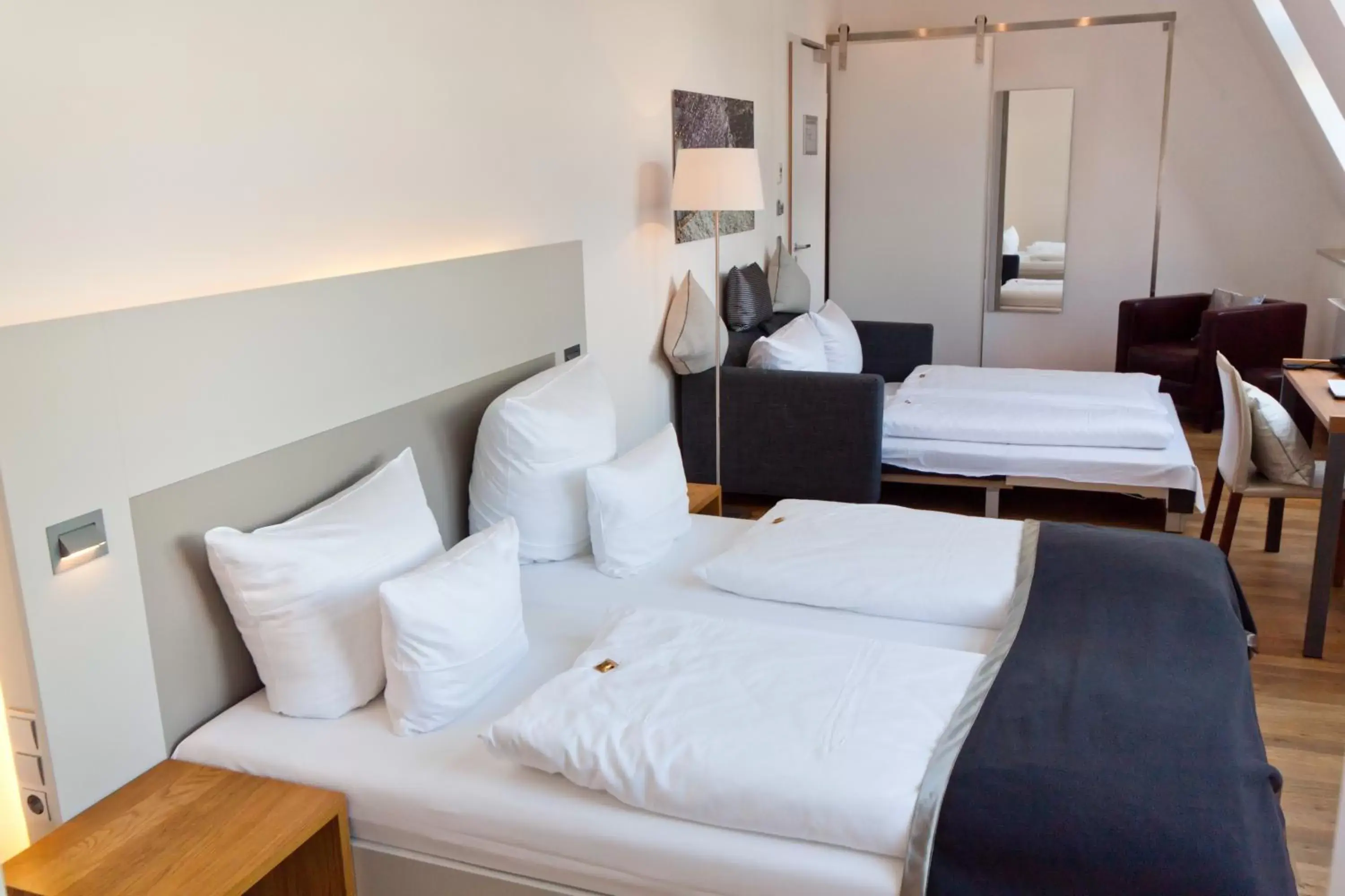 Photo of the whole room, Bed in Qube Hotel Bergheim