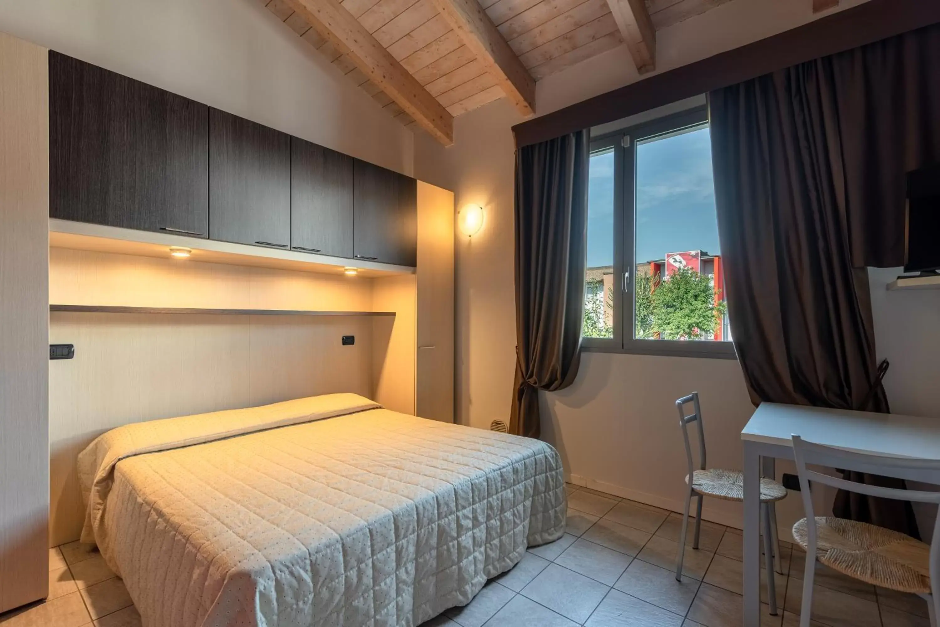 Photo of the whole room, Bed in Hotel Maranello Village