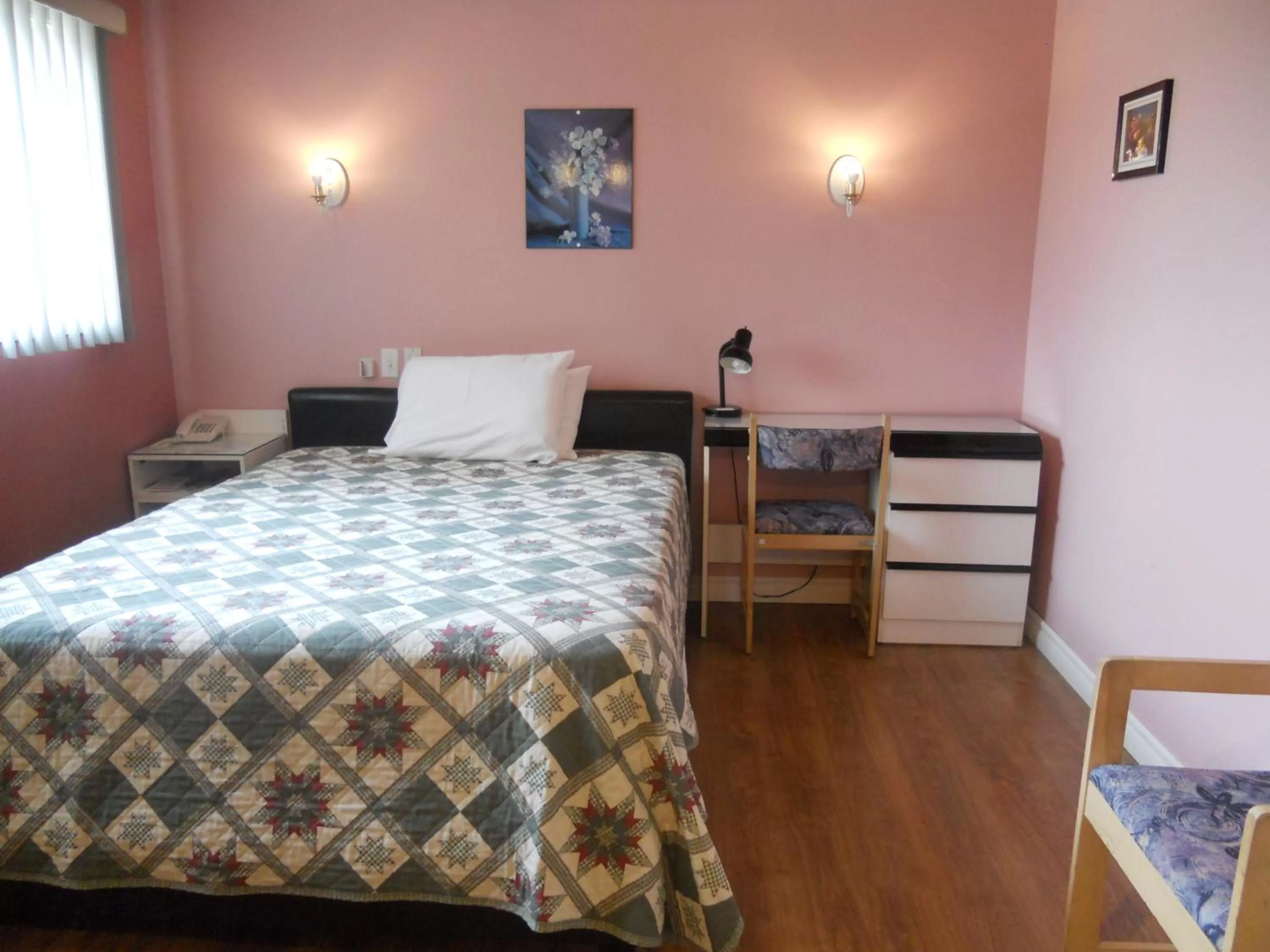 Bed in Motel Normandie