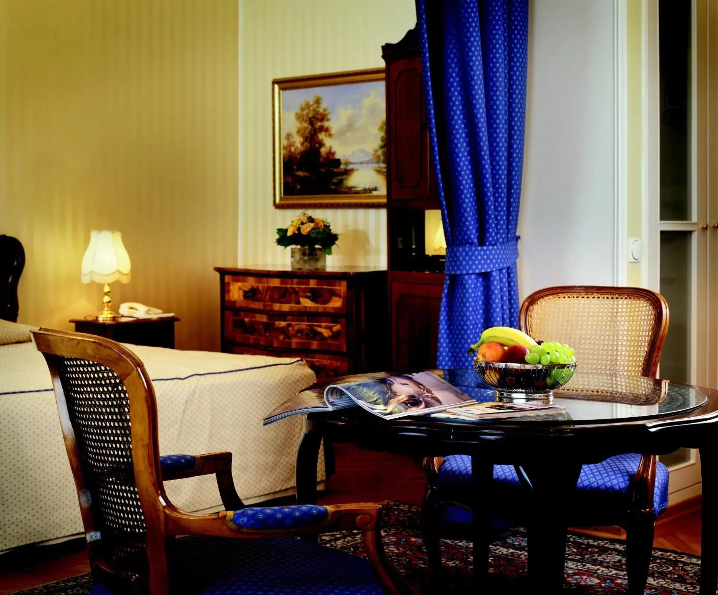 Bed, Dining Area in Hotel Ambassador