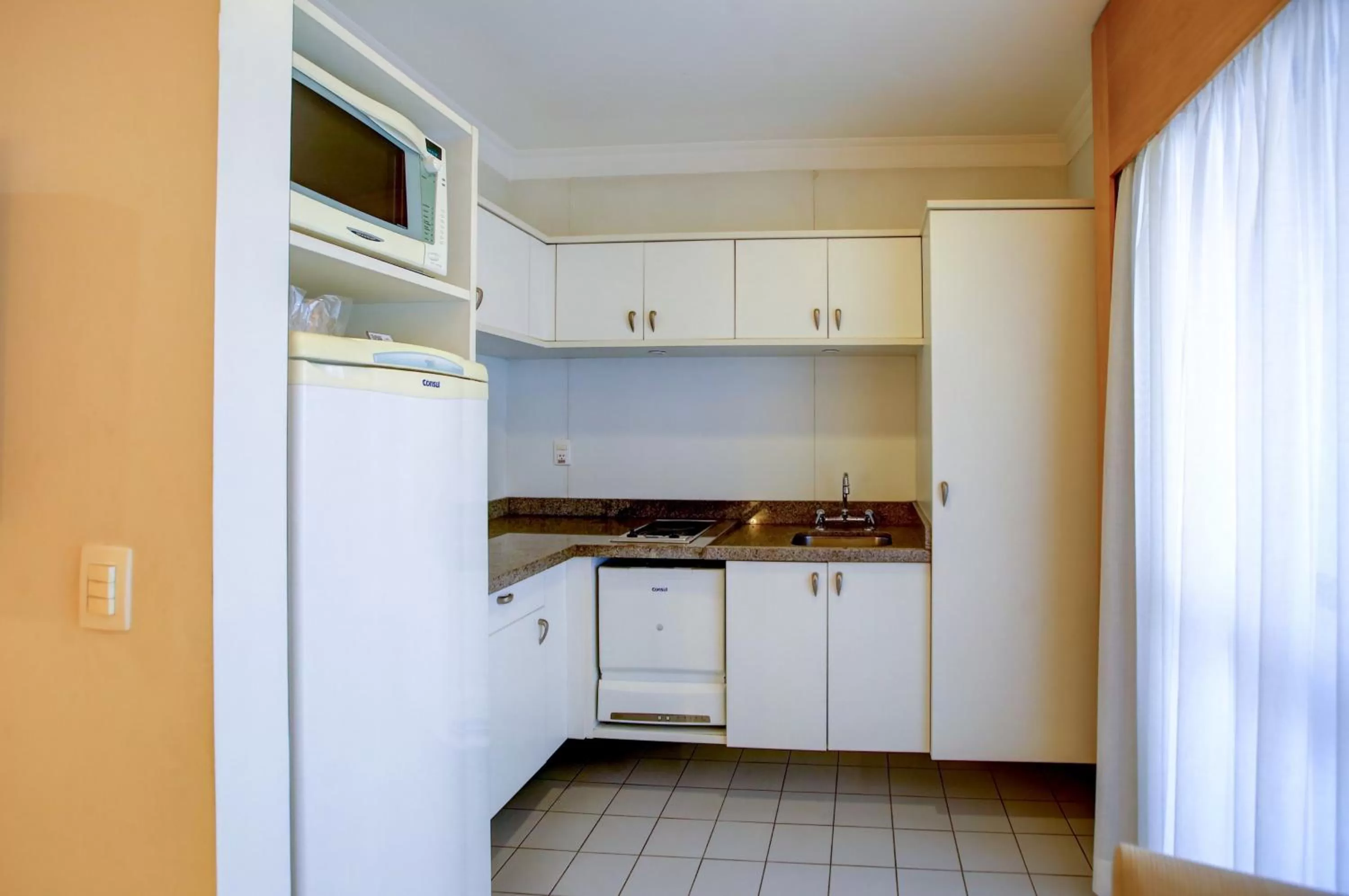 Kitchen or kitchenette in eSuítes Congonhas by Atlantica