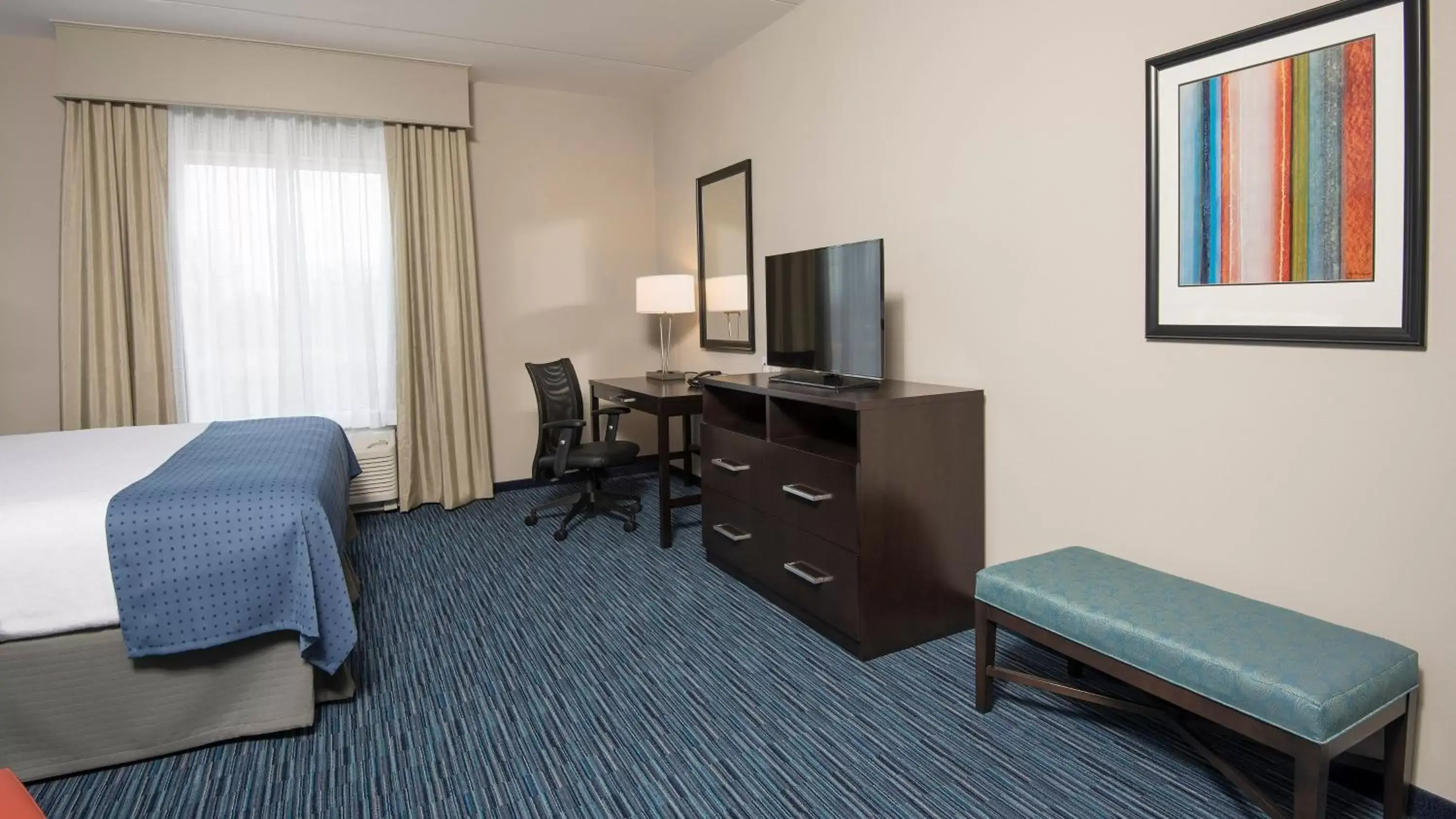 Photo of the whole room, TV/Entertainment Center in Holiday Inn Indianapolis Airport, an IHG Hotel