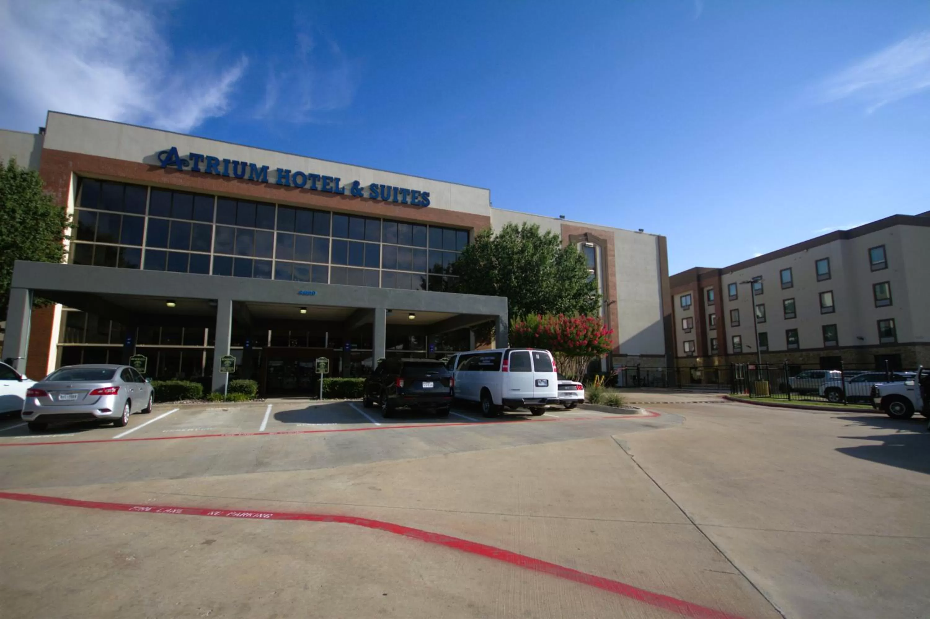 Property building in Atrium Hotel and Suites DFW Airport
