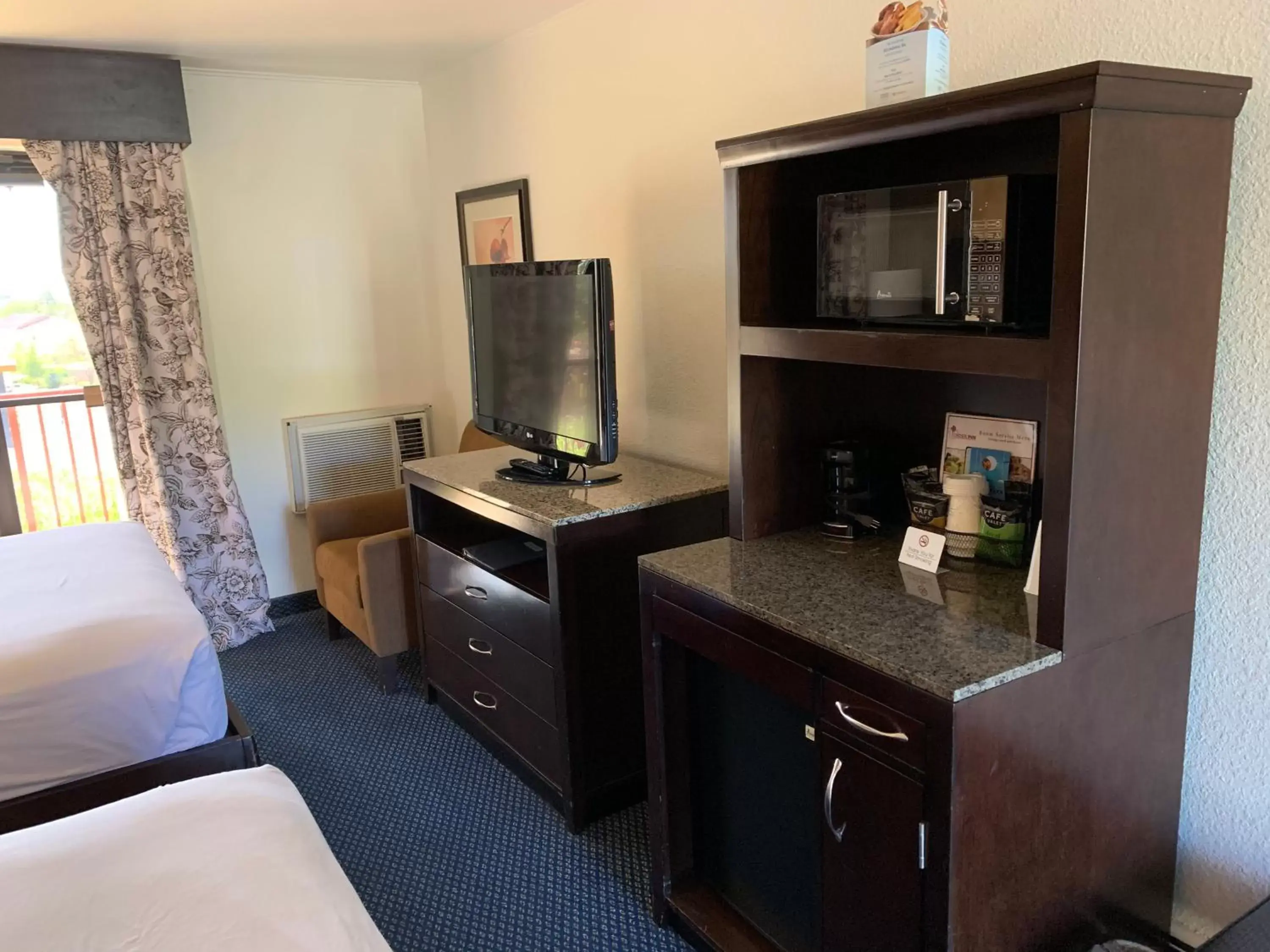 TV and multimedia, TV/Entertainment Center in Travelodge by Wyndham Rapid City