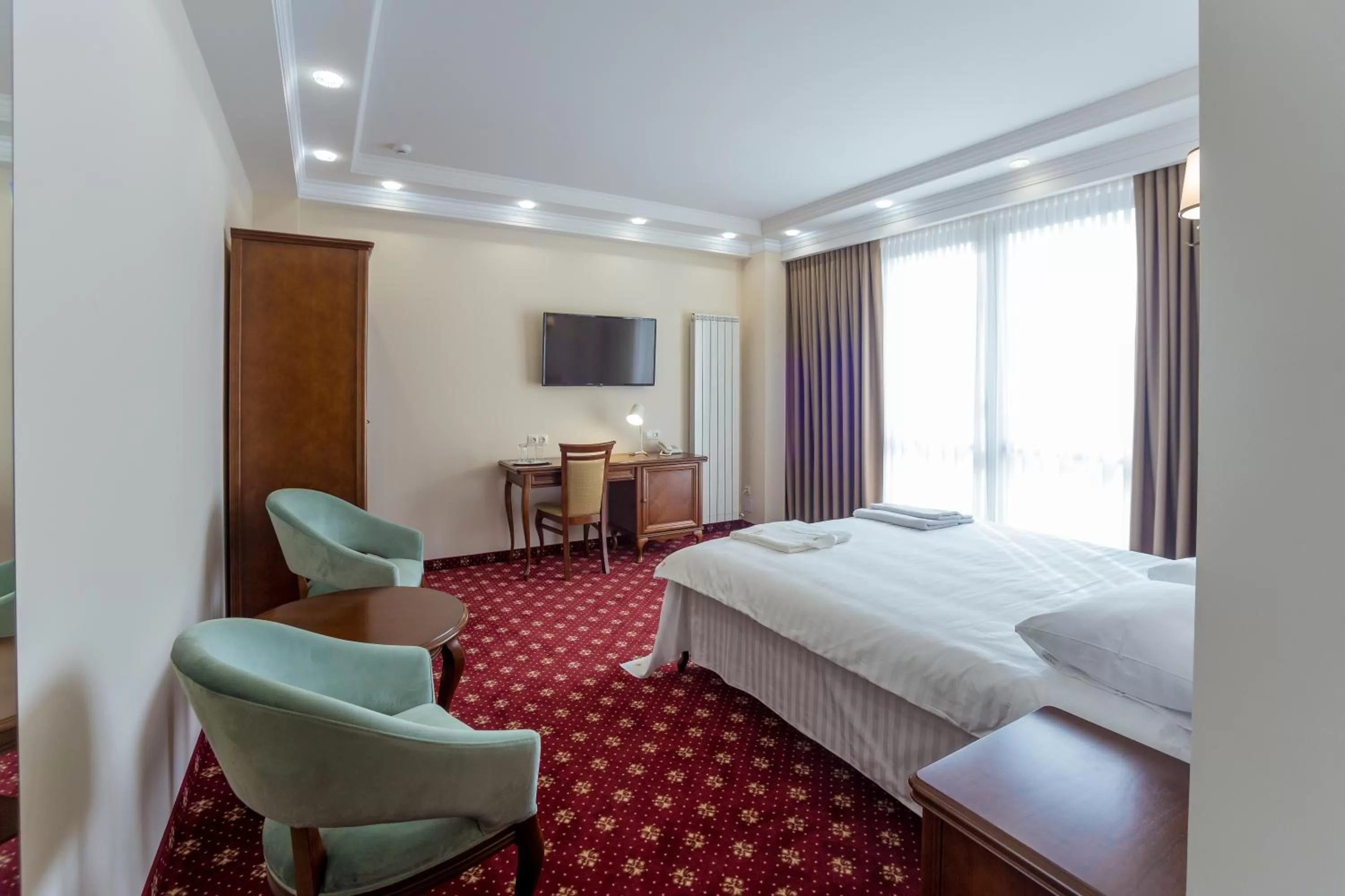 Photo of the whole room, Bed in Ambassador Hotel