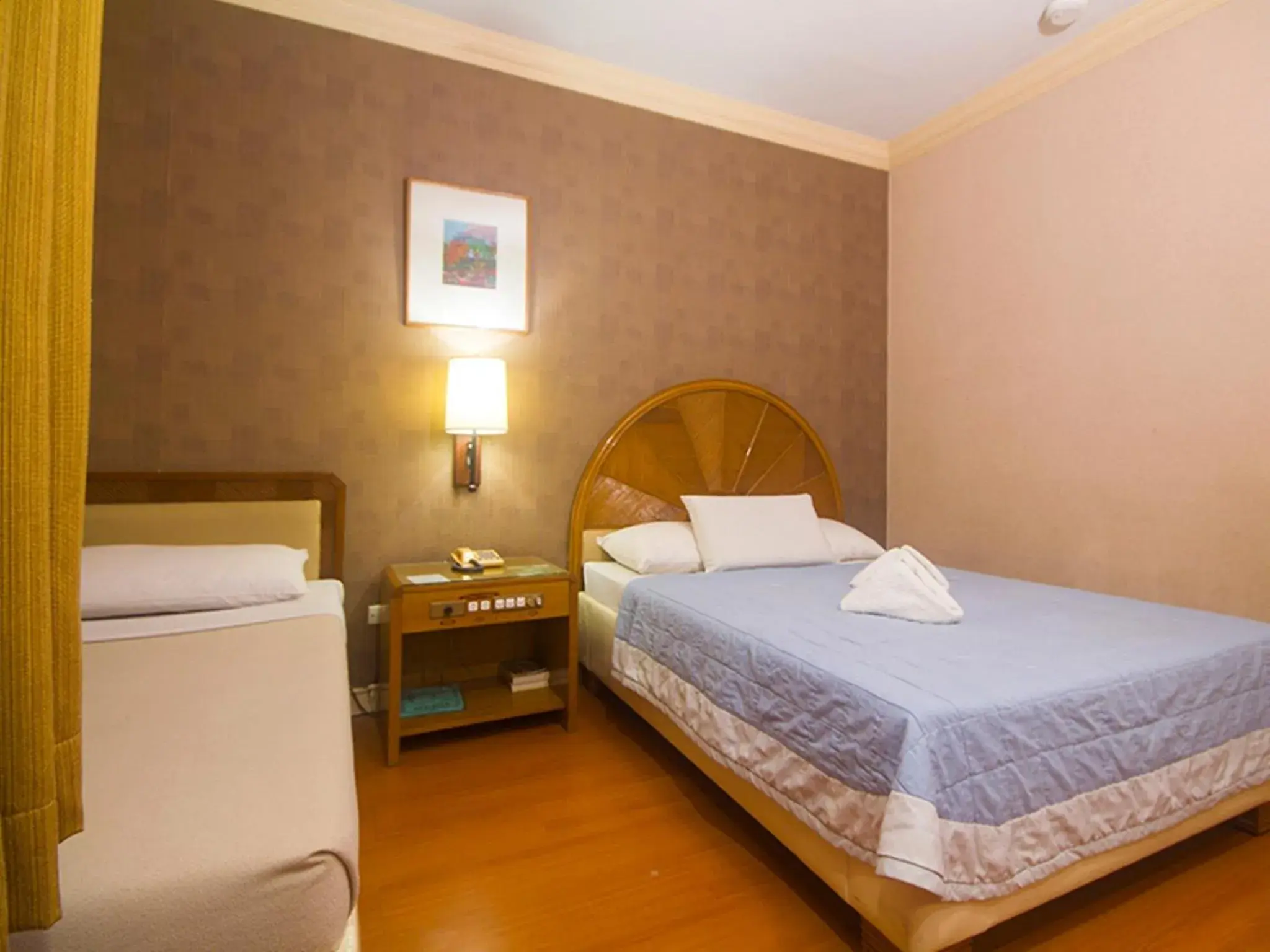 Bed in Grand City Hotel