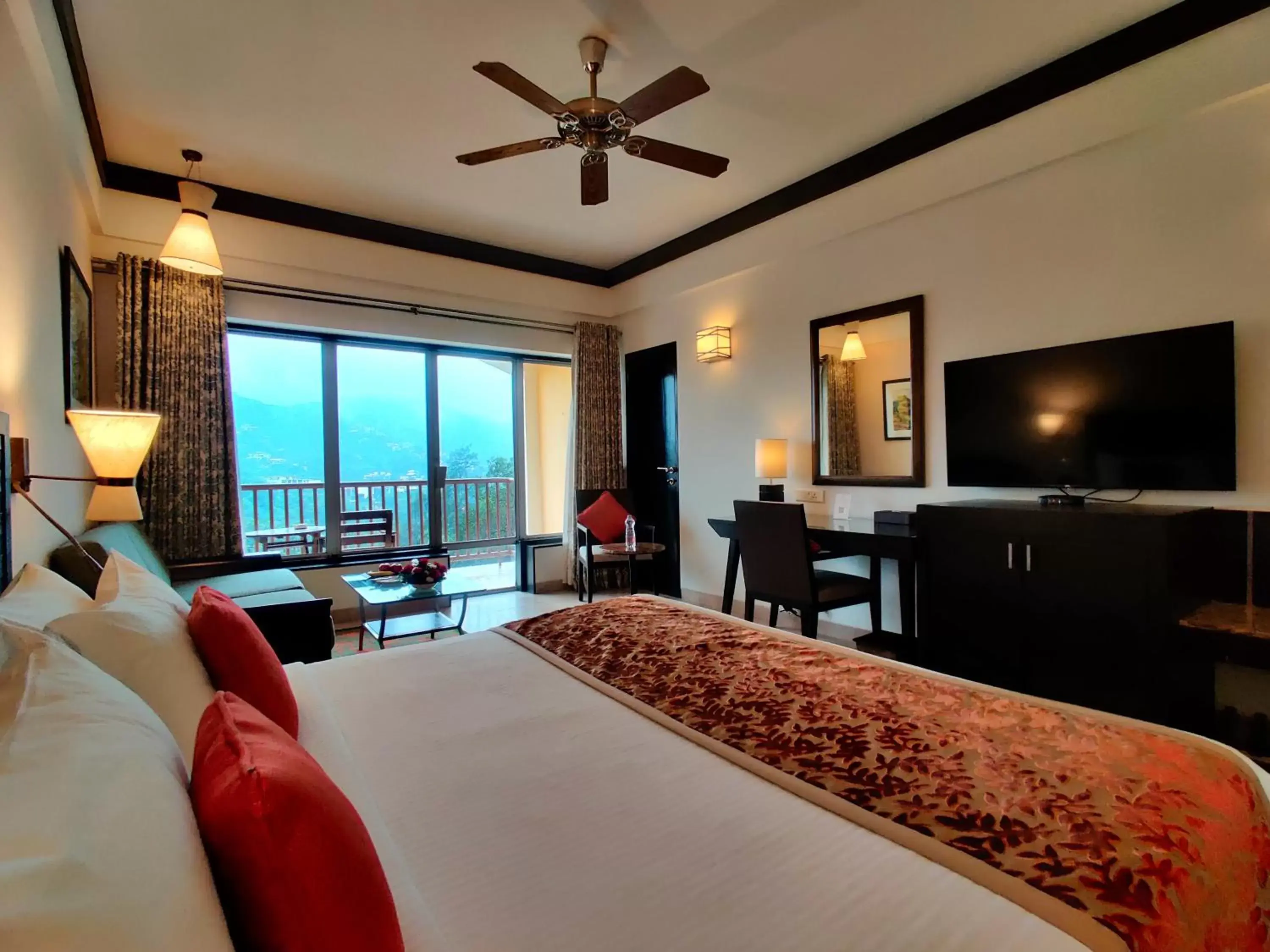 Bed, TV/Entertainment Center in Fariyas Resort Lonavala