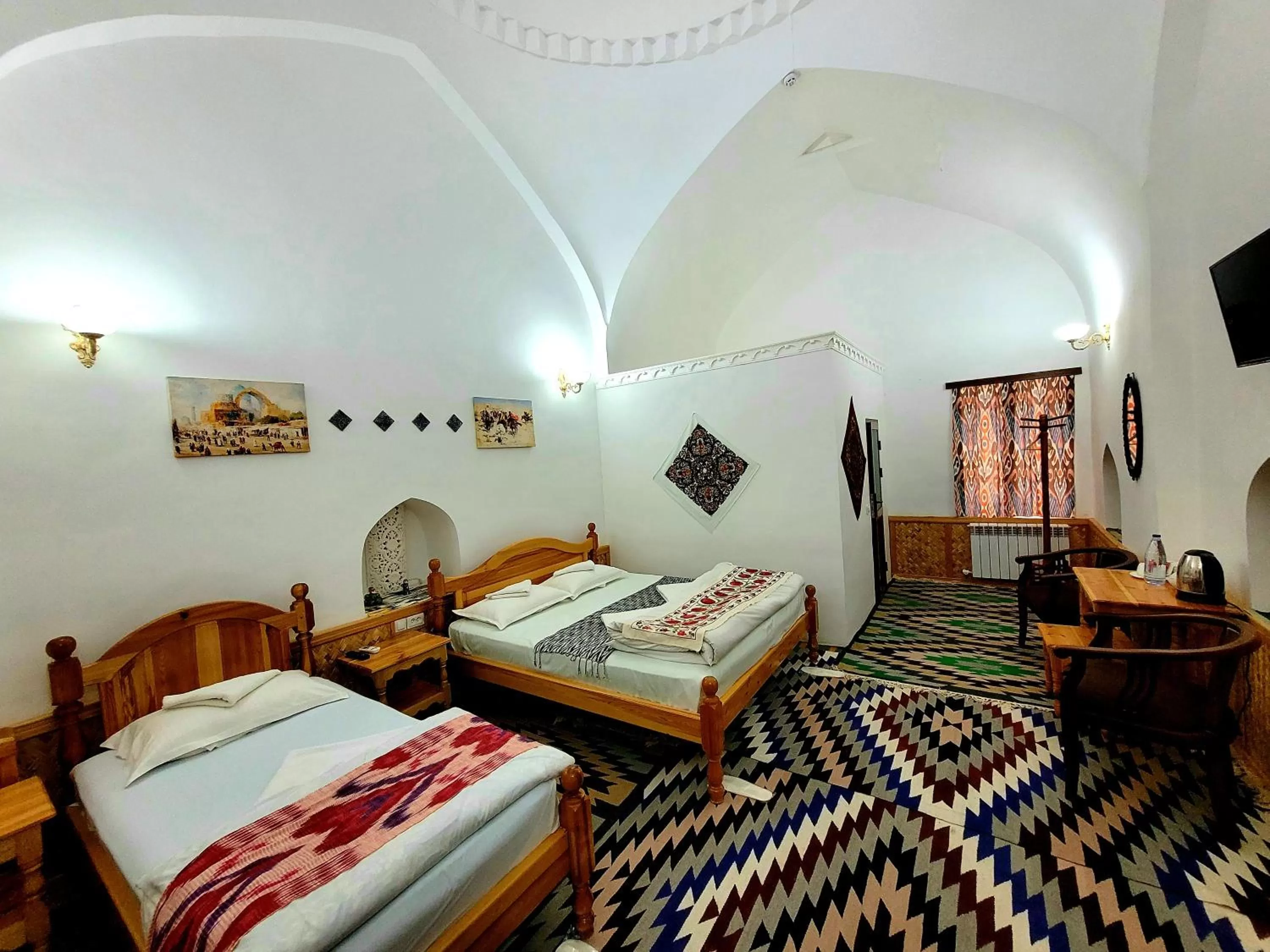 Bed in madrasah Polvon-Qori boutique hotel XIX century