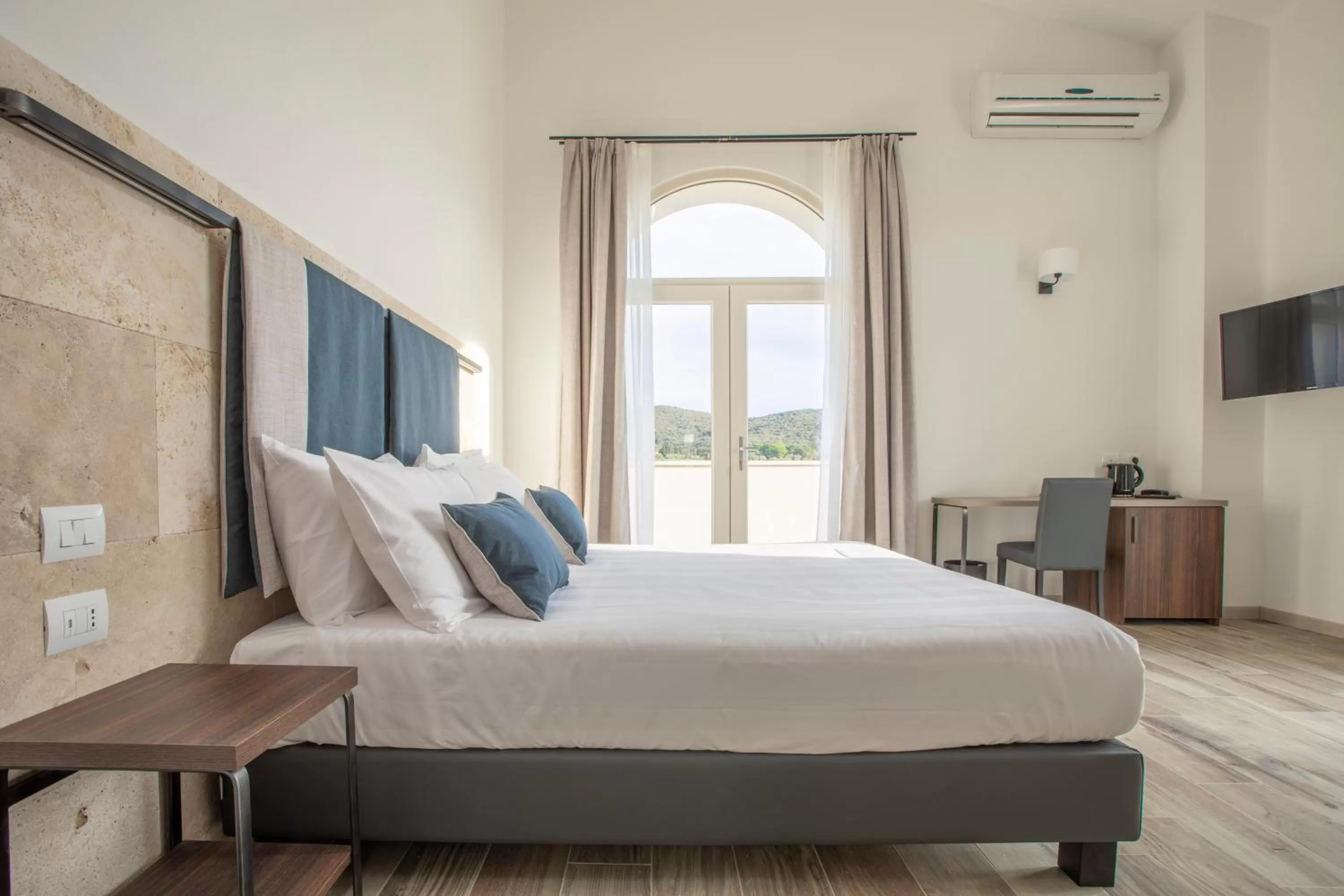 Bed in Riva Toscana Golf Resort & SPA